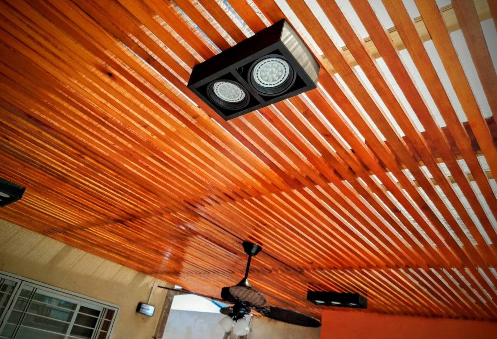 an abstract photo of a curved building with a blue sky in the background