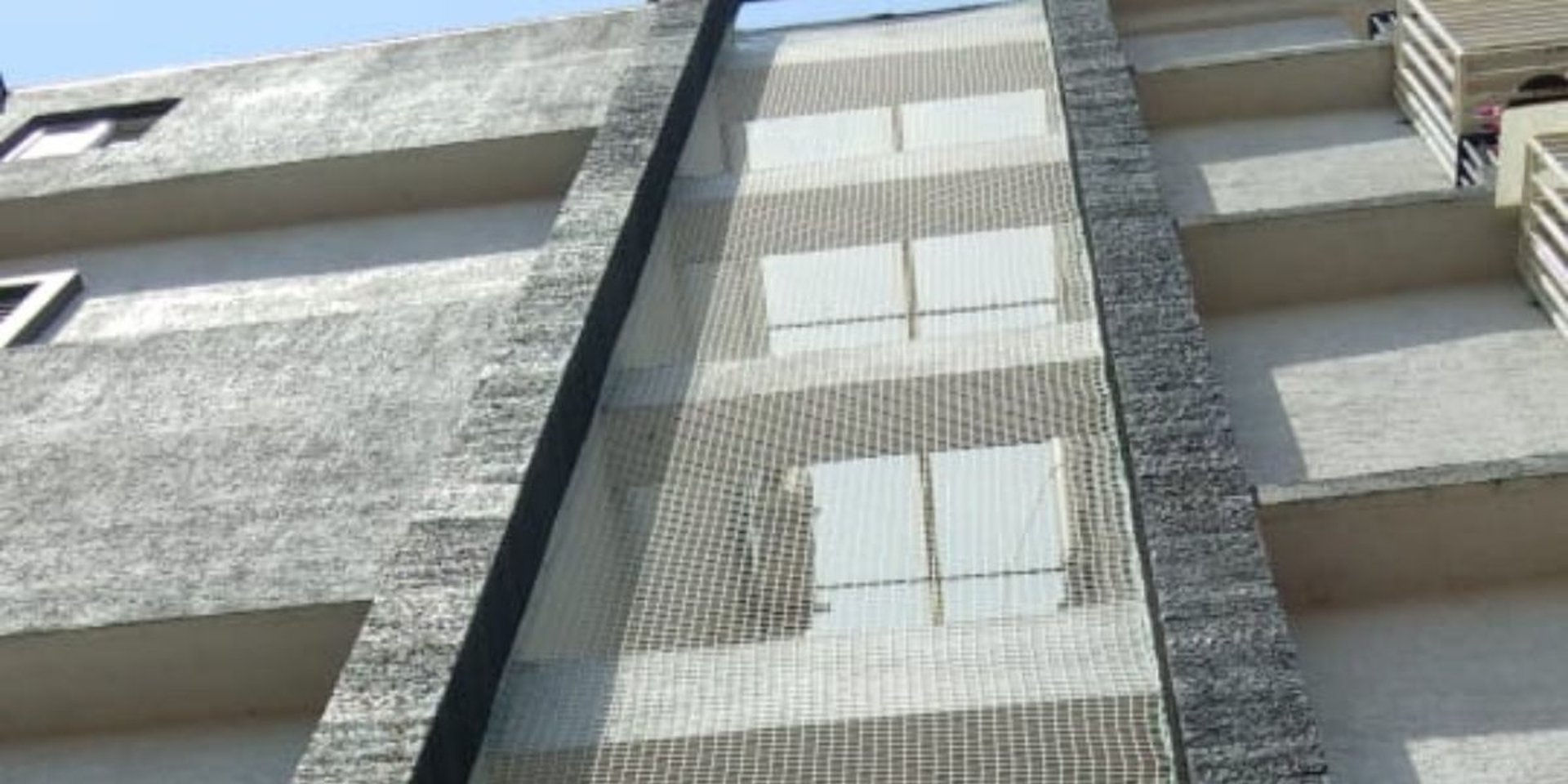 woman wearing yellow long-sleeved dress under white clouds and blue sky during daytime