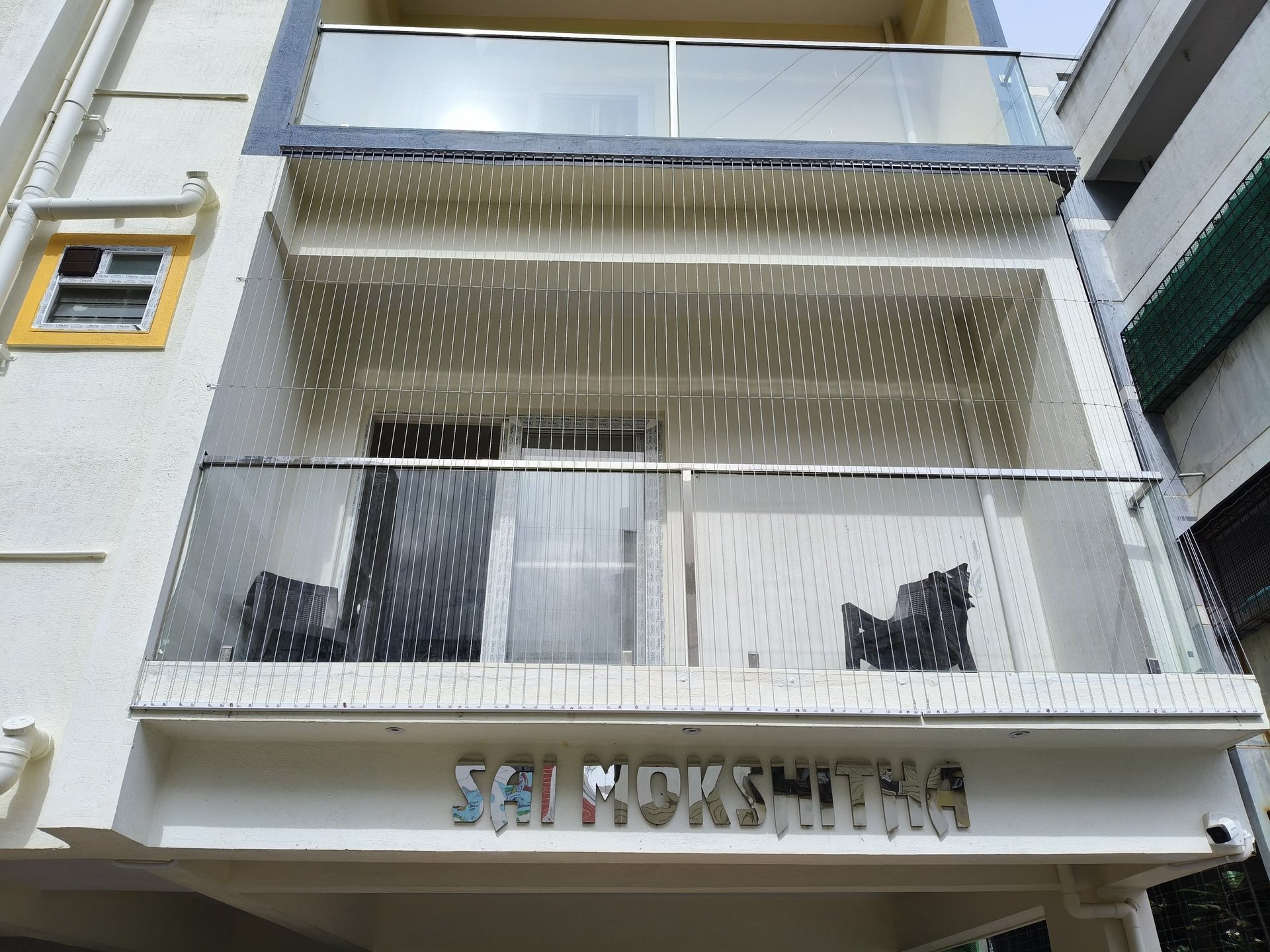 an abstract photo of a curved building with a blue sky in the background