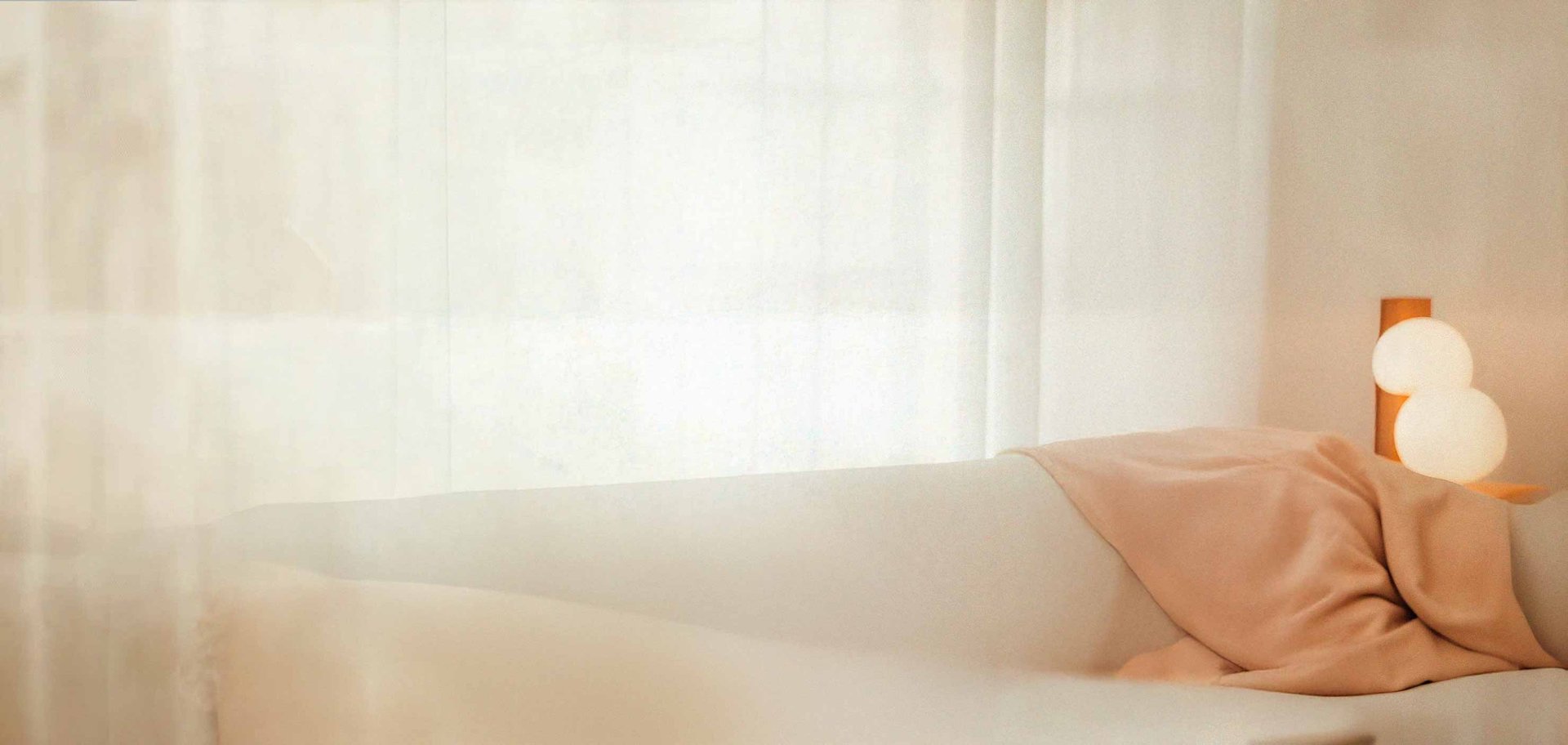 an abstract photo of a curved building with a blue sky in the background