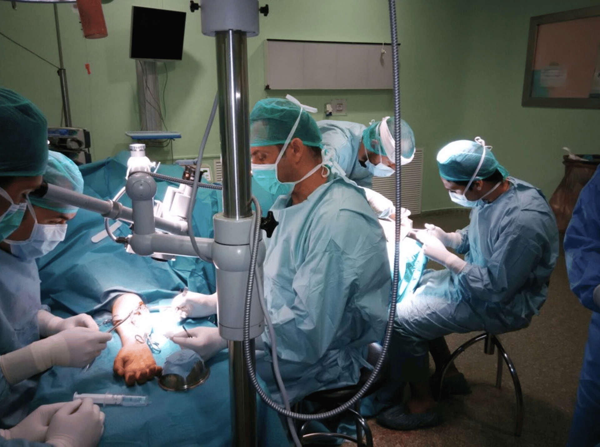 A couple of doctors in scrubs in a room