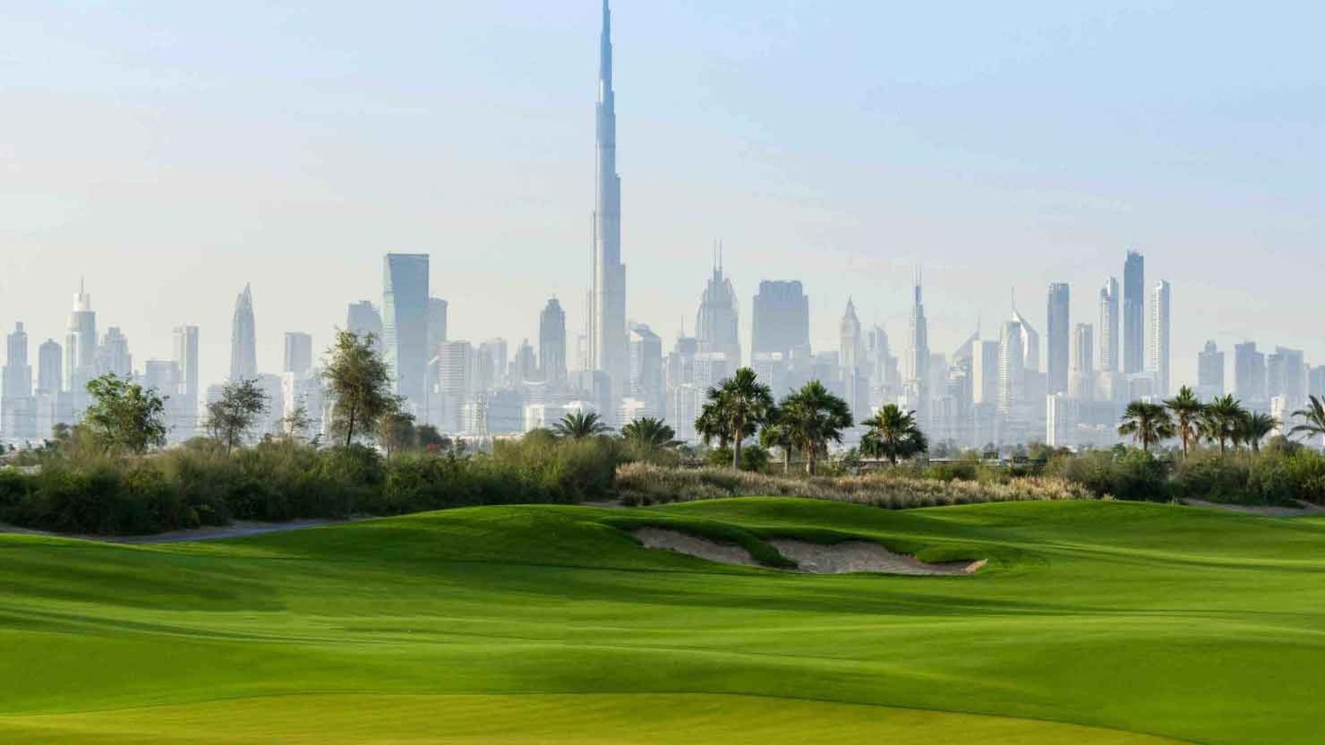 view of Downtown Dubai showing Burj Khalifa, Dubai Opera and high-rise residences overlooking the city center.