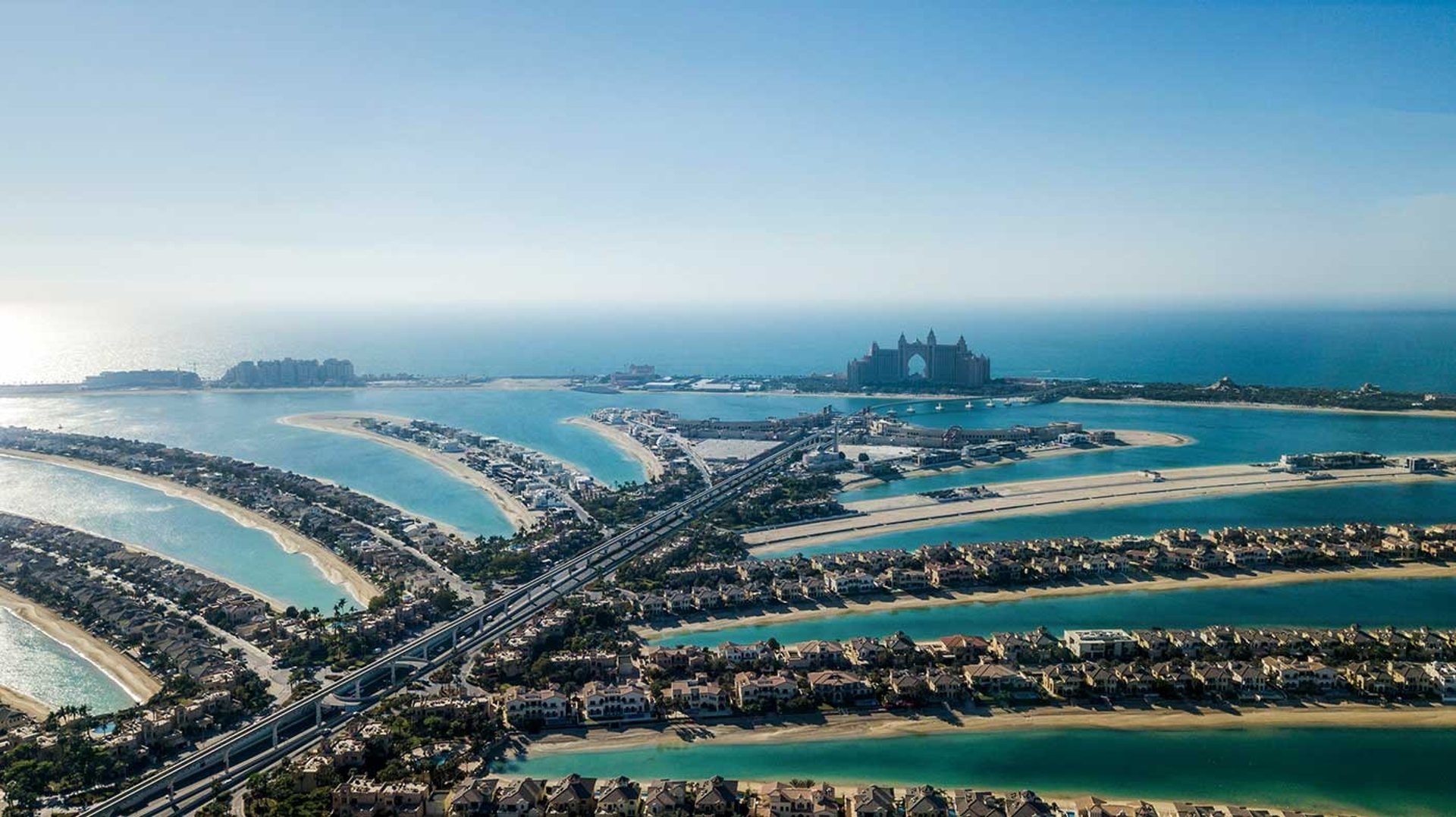 Aerial view of Palm Jumeirah Dubai with luxury waterfront villas and Atlantis The Palm