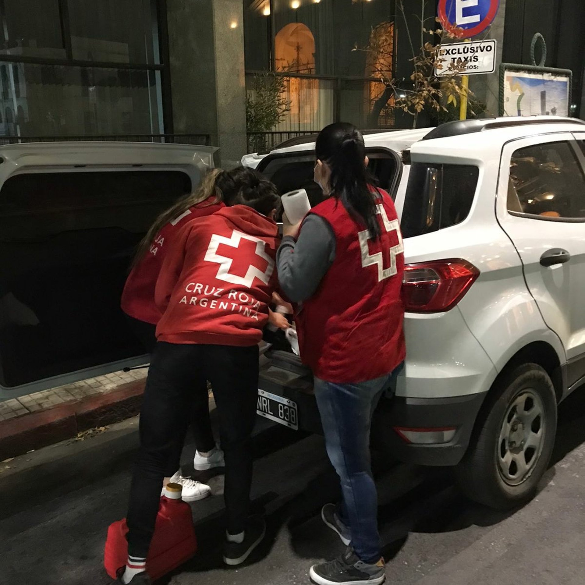 an abstract photo of a curved building with a blue sky in the background