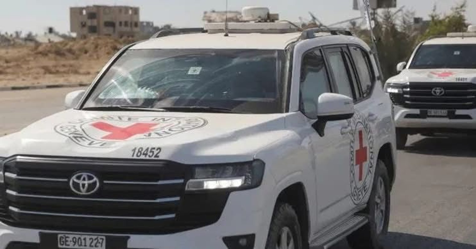 an abstract photo of a curved building with a blue sky in the background