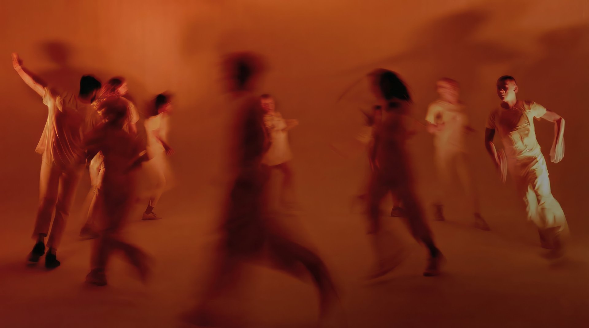 an abstract photo of a curved building with a blue sky in the background