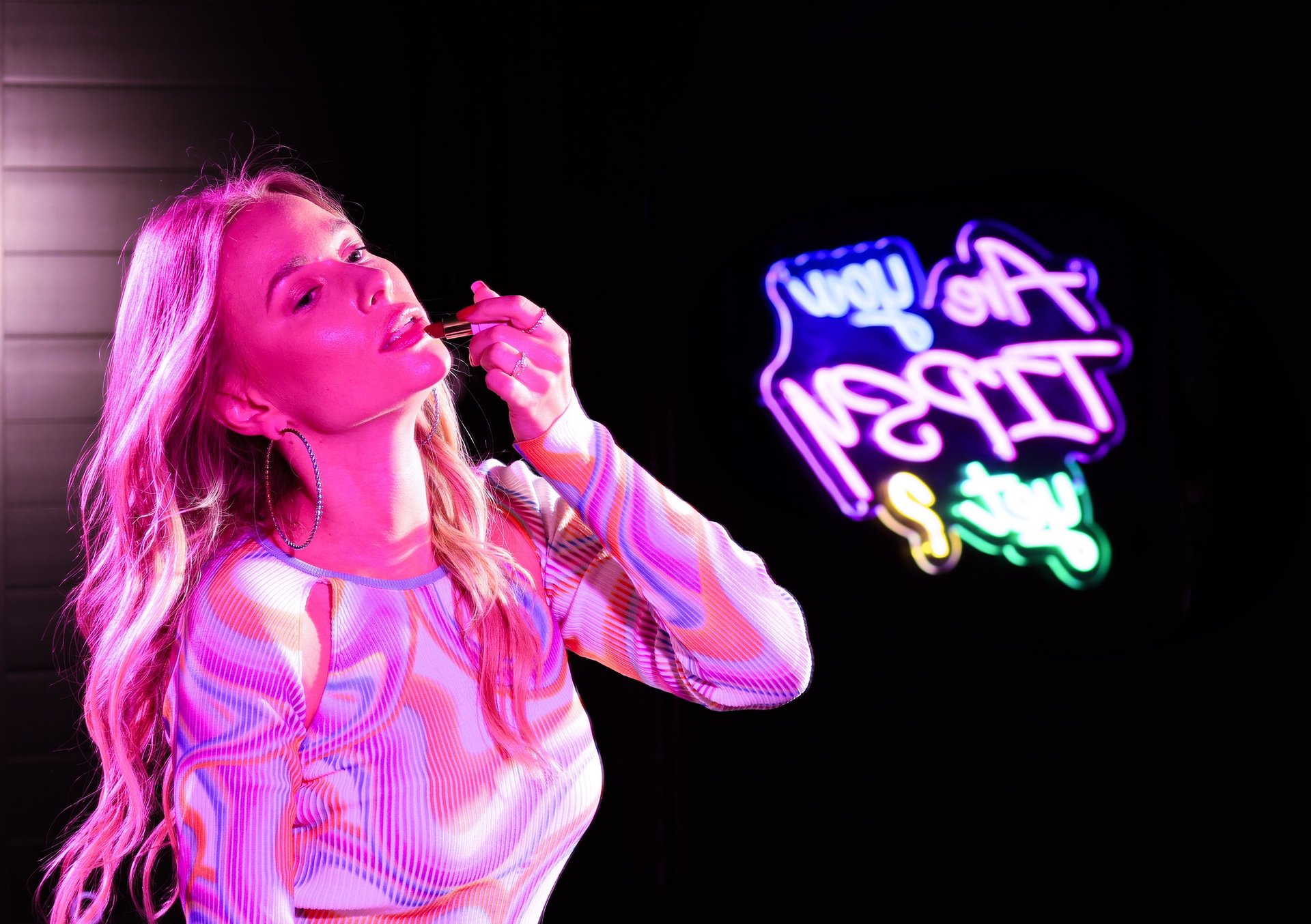 an abstract photo of a curved building with a blue sky in the background