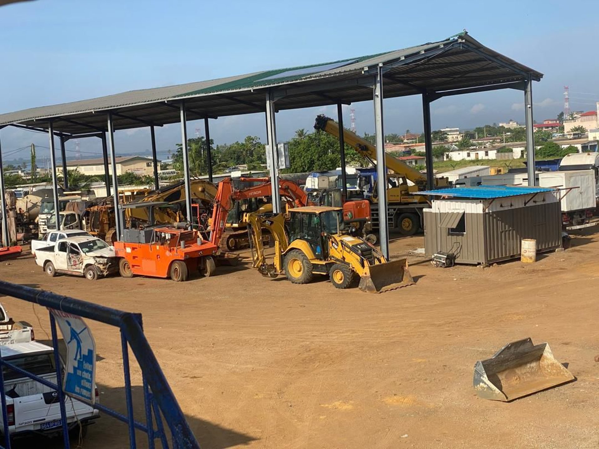 an abstract photo of a curved building with a blue sky in the background