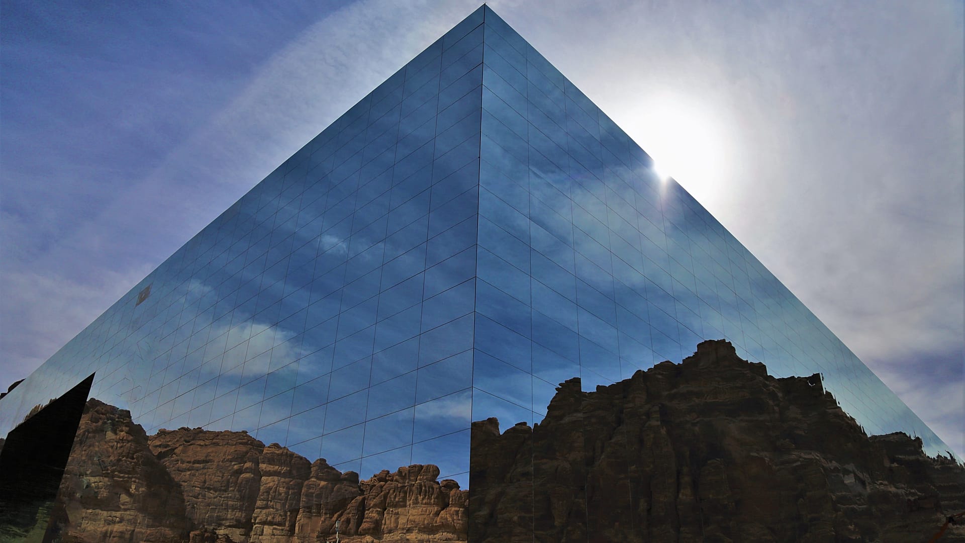 person standing and putting oil on sliced zucchini