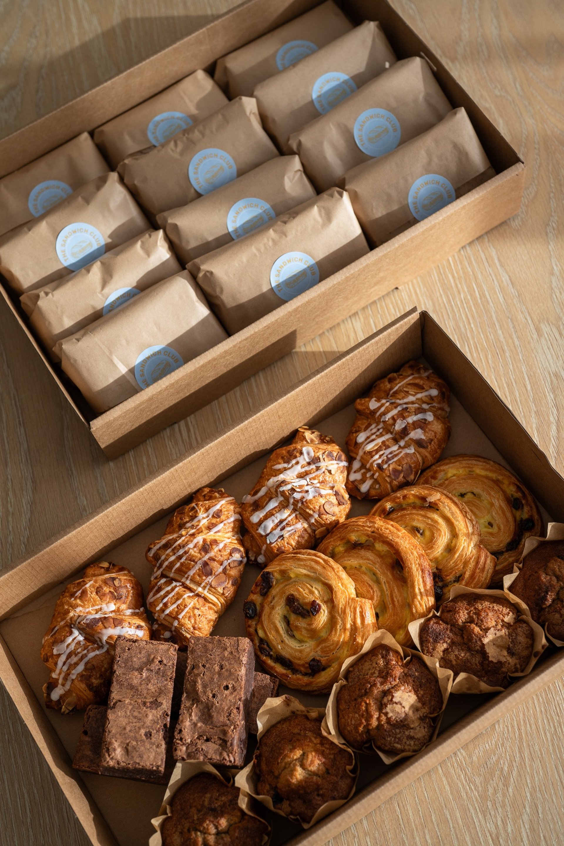 a row of mini sandwiches sitting on top of a white plate