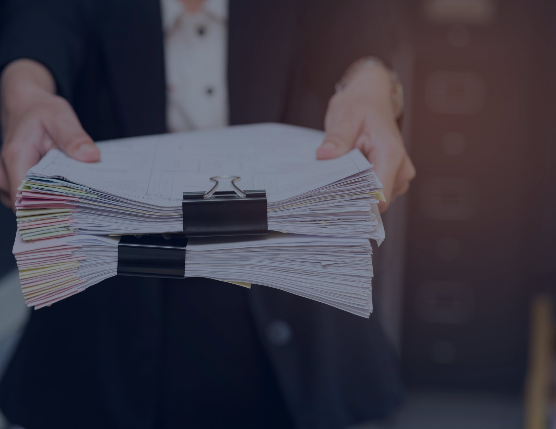 an abstract photo of a curved building with a blue sky in the background