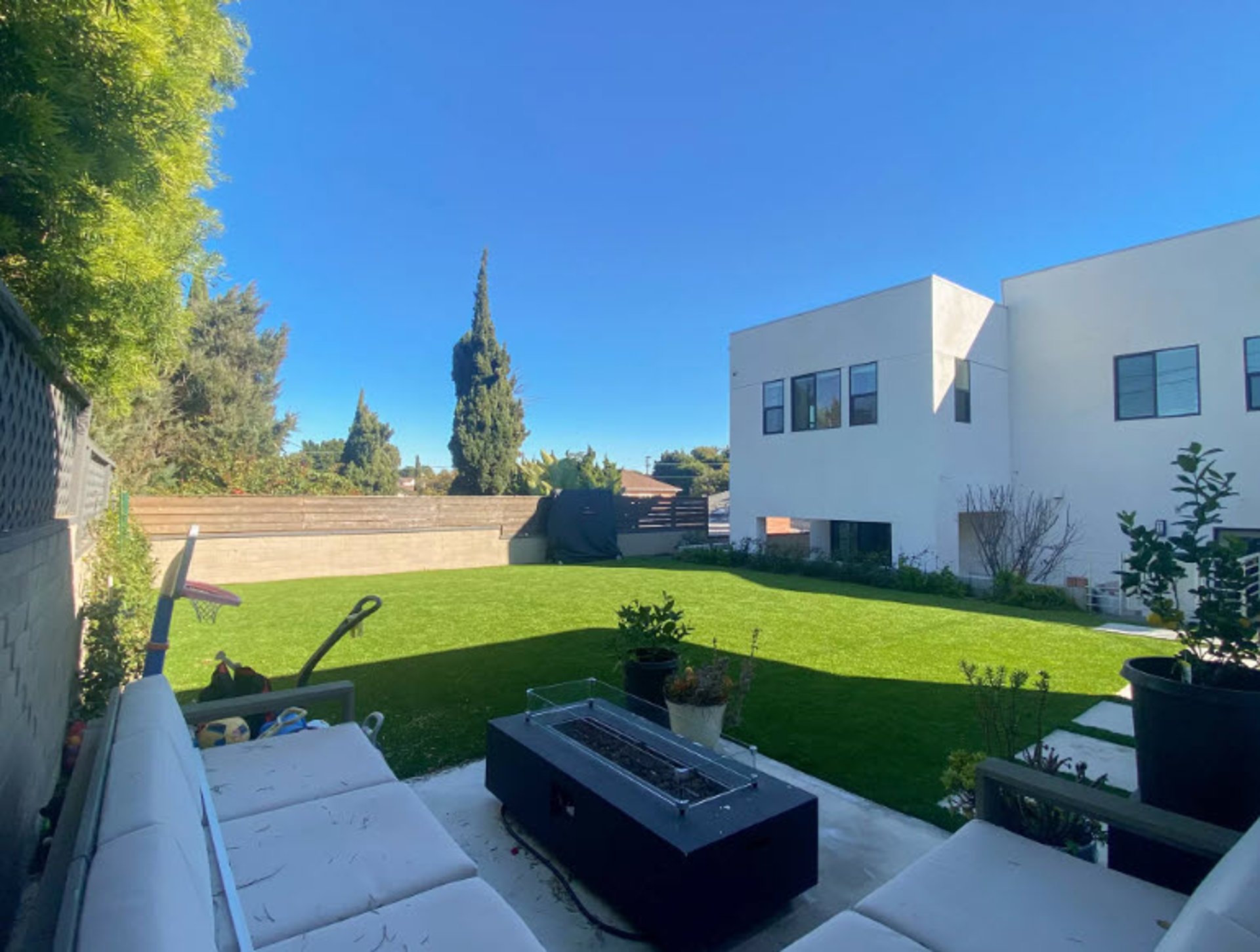 woman wearing yellow long-sleeved dress under white clouds and blue sky during daytime