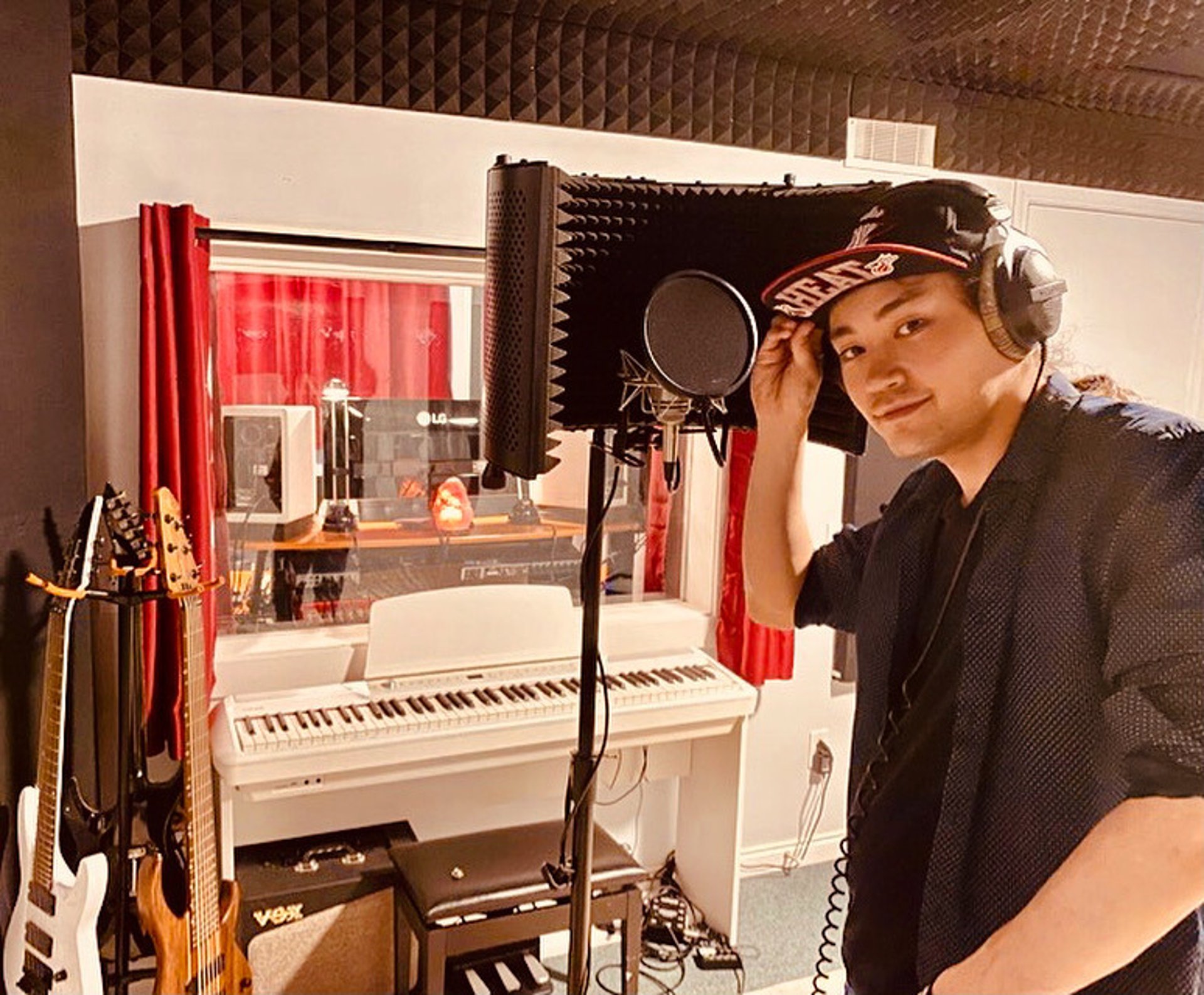 man in blue denim jacket playing piano