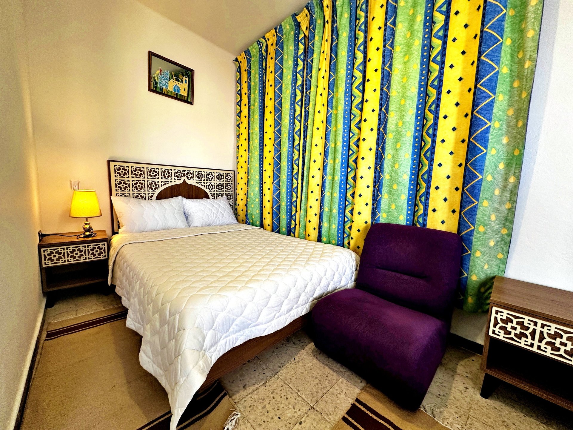 an abstract photo of a curved building with a blue sky in the background