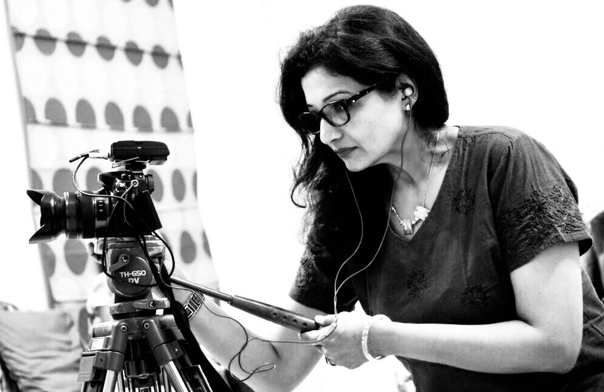 an abstract photo of a curved building with a blue sky in the background