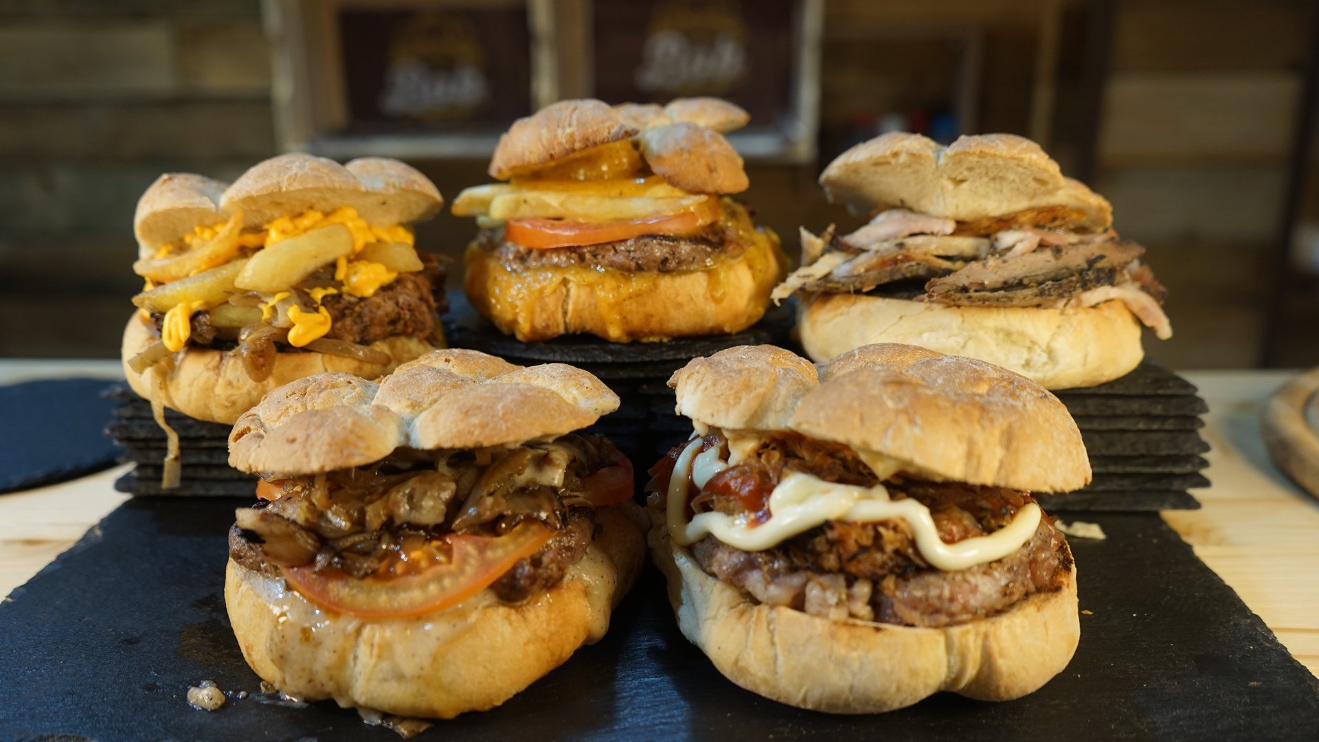 burger and fries on brown paper bag