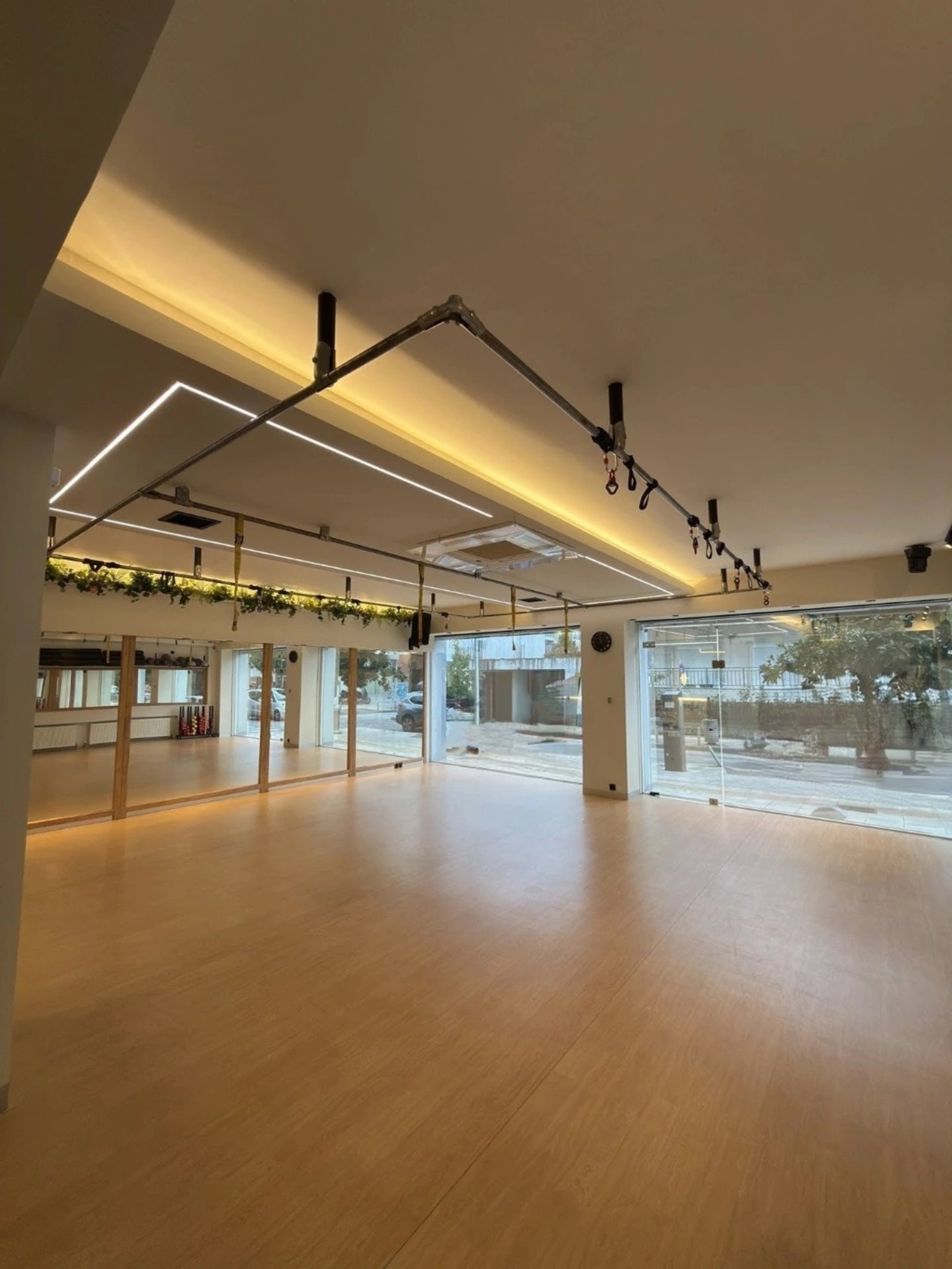 woman standing surrounded by exercise equipment