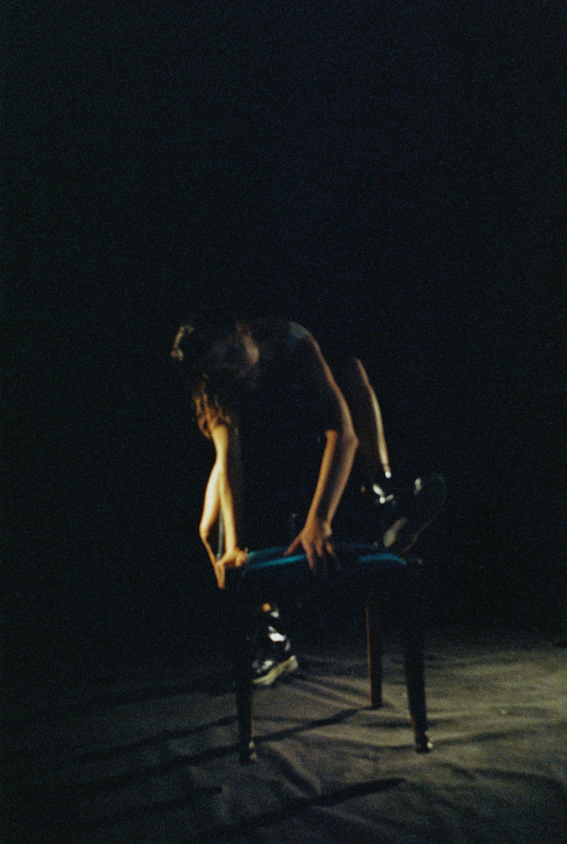 an abstract photo of a curved building with a blue sky in the background