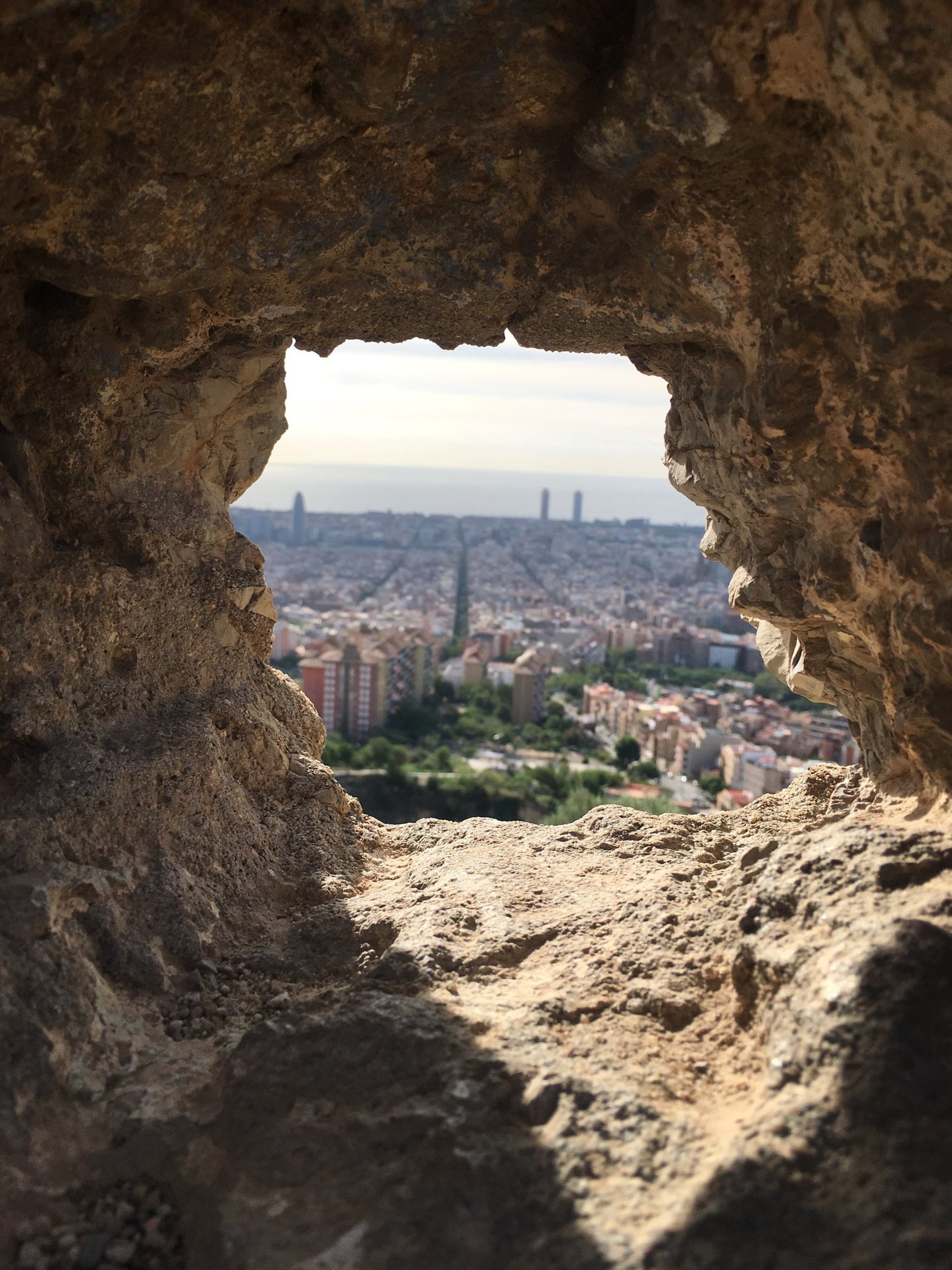 an abstract photo of a curved building with a blue sky in the background
