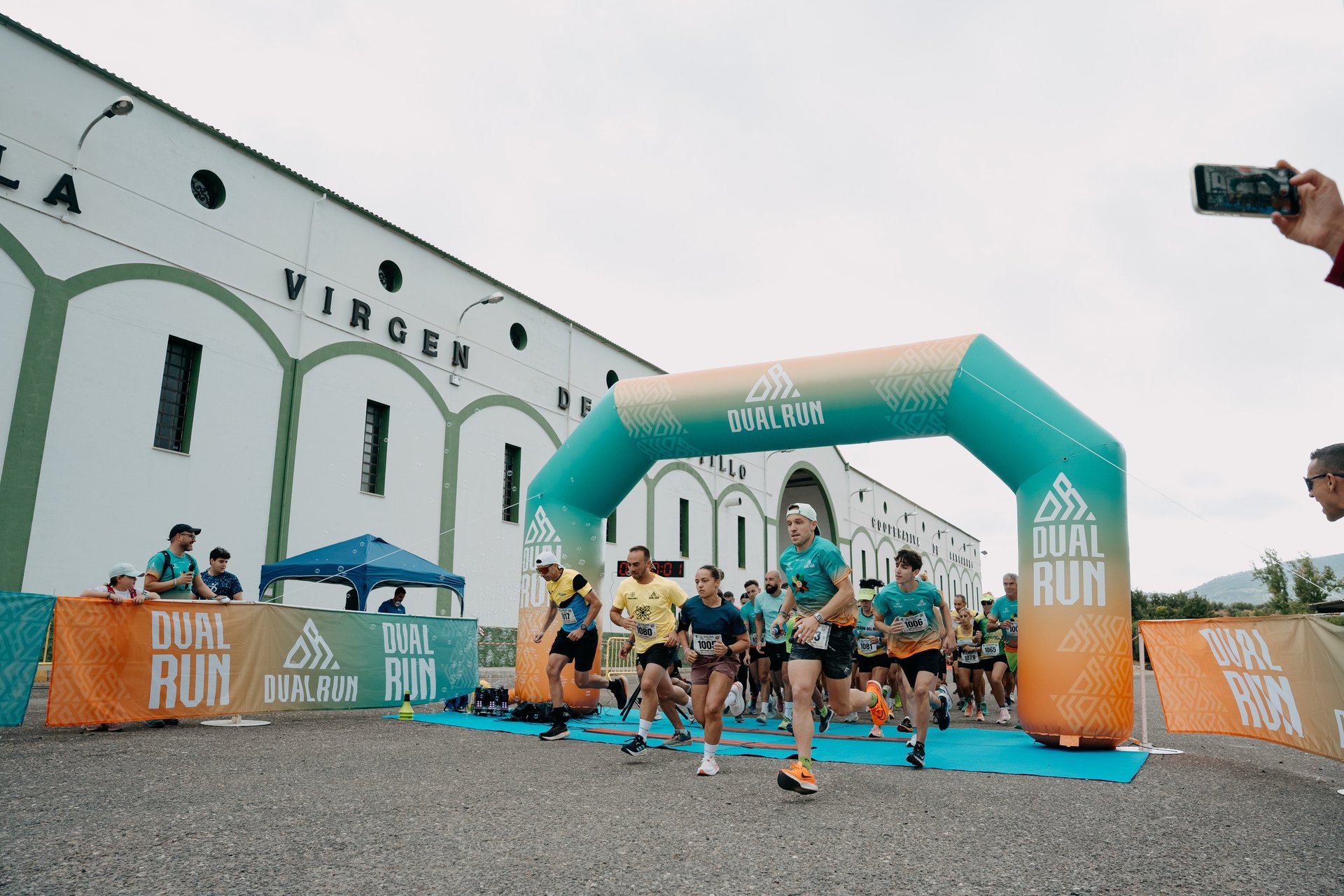 people running on gray soil near boat