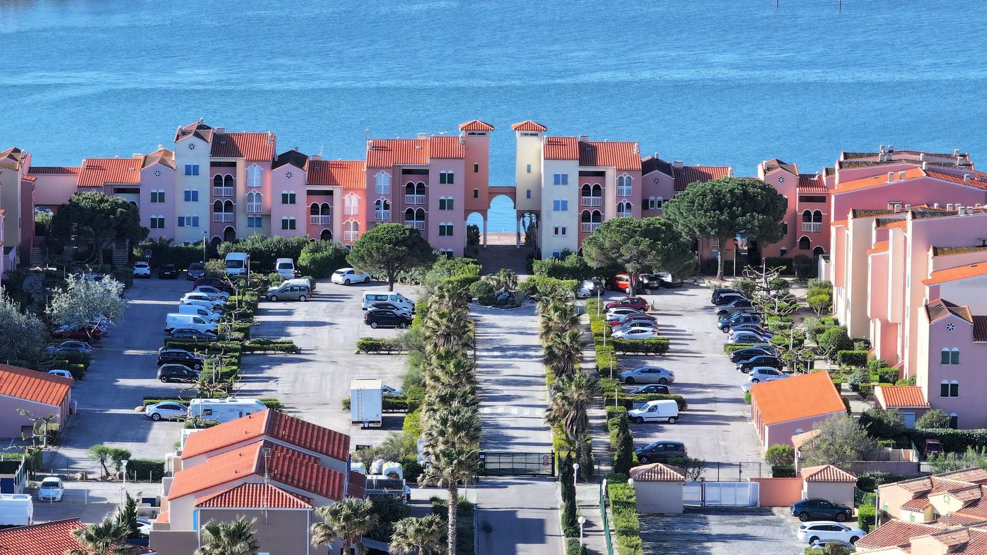 woman wearing yellow long-sleeved dress under white clouds and blue sky during daytime