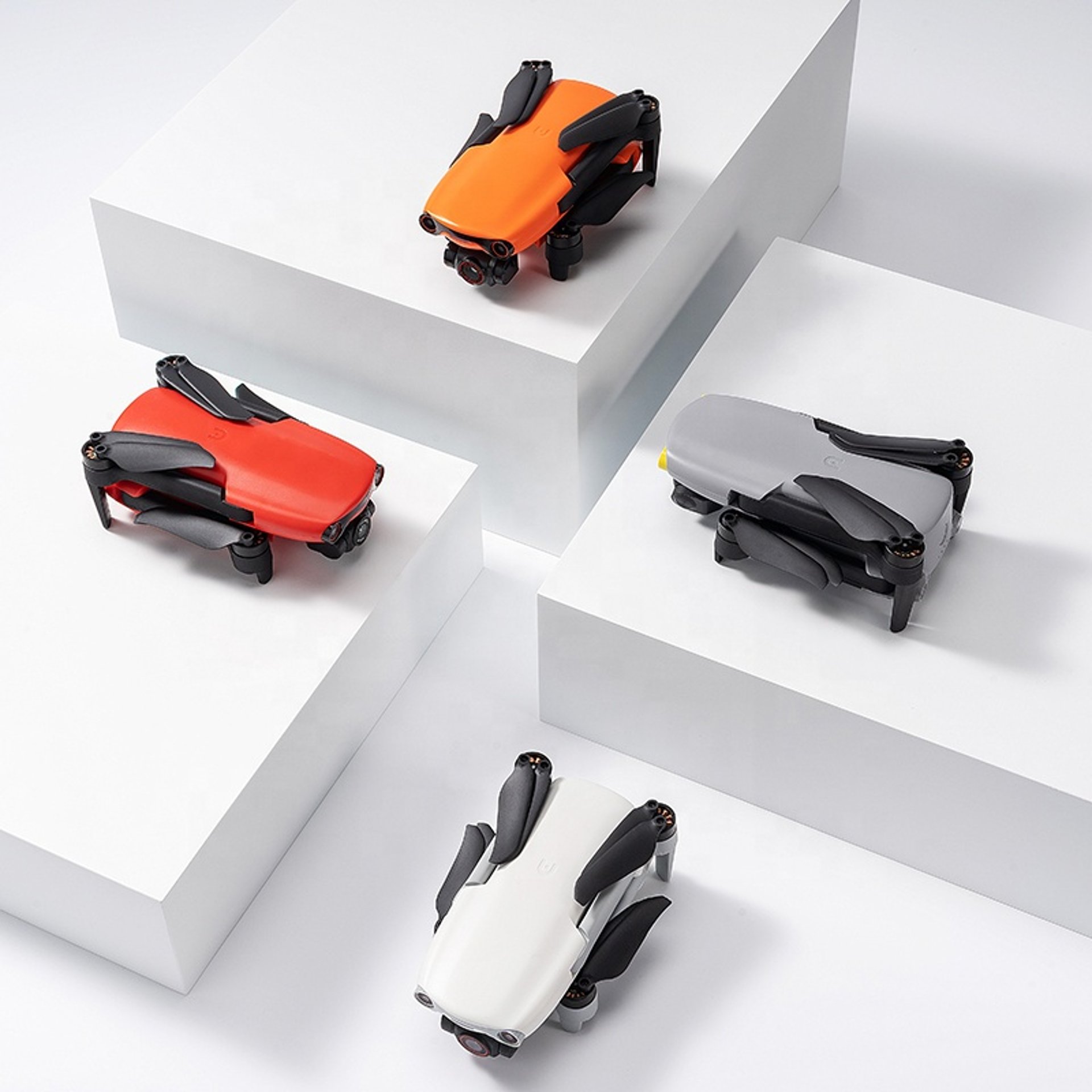 Person controls a drone with its remote controller.