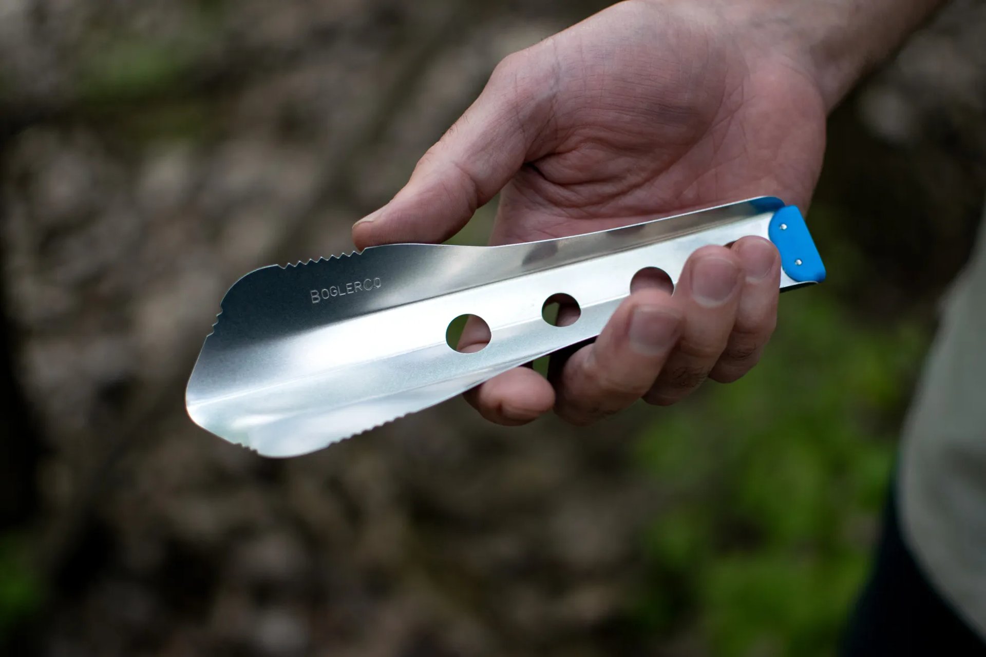 male hand holding boglerco trowel
