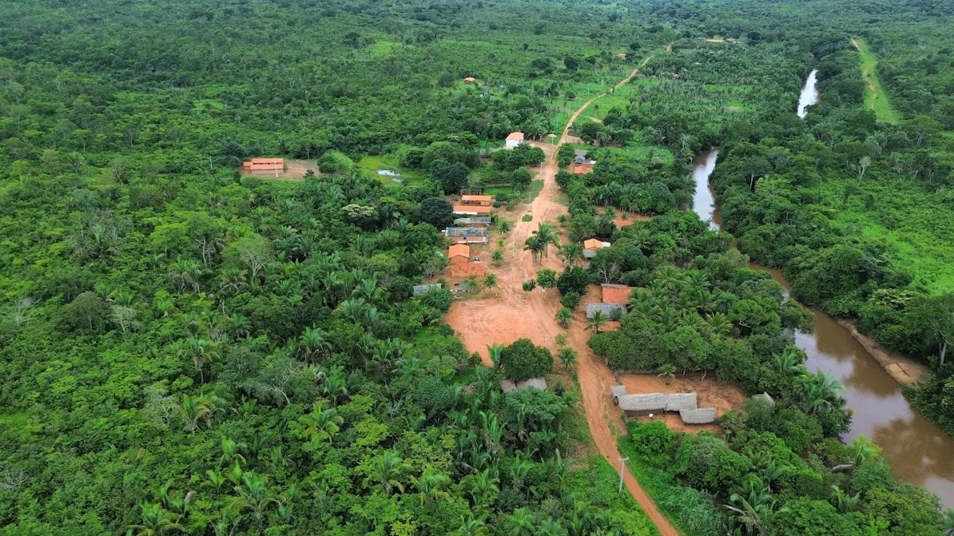 man standing beside camping tent wearing headlamp during nighttime