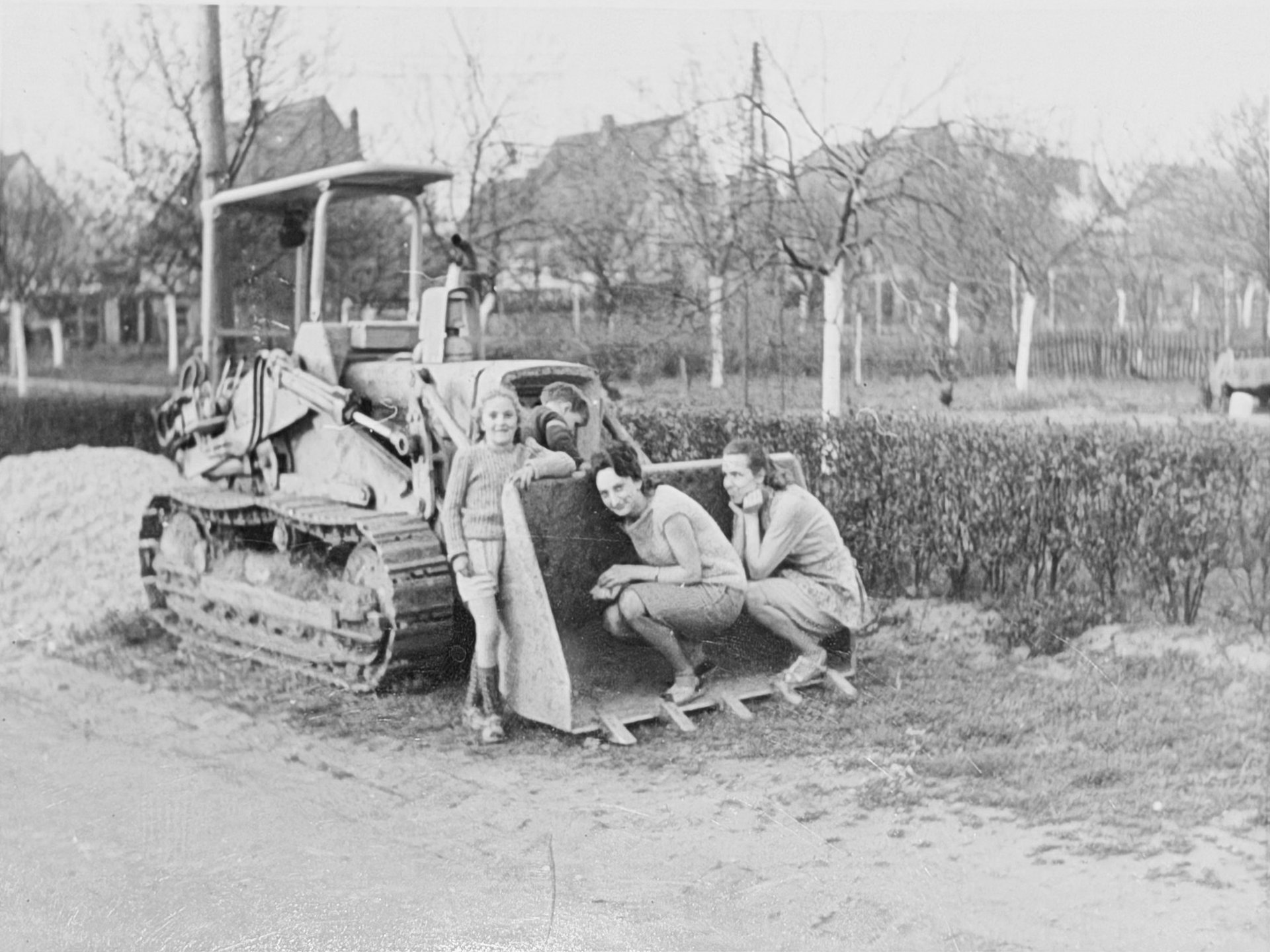 orange and white excavator on brown ground during daytime