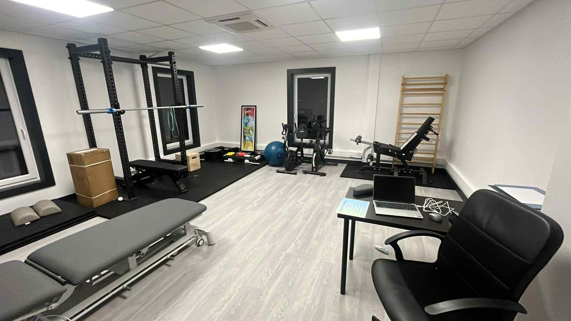 three pairs of assorted-color Rogue bumper plates