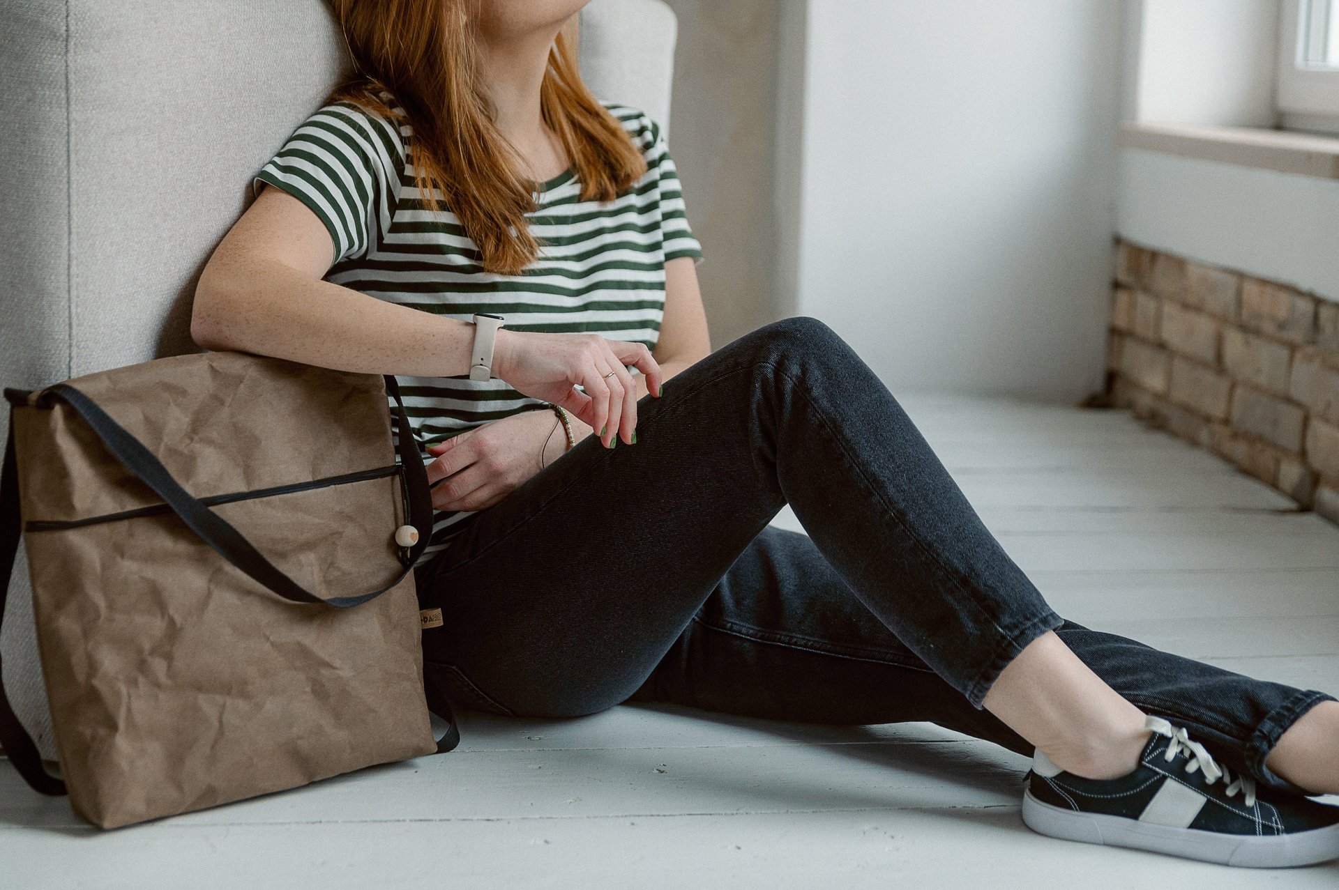woman wearing yellow long-sleeved dress under white clouds and blue sky during daytime