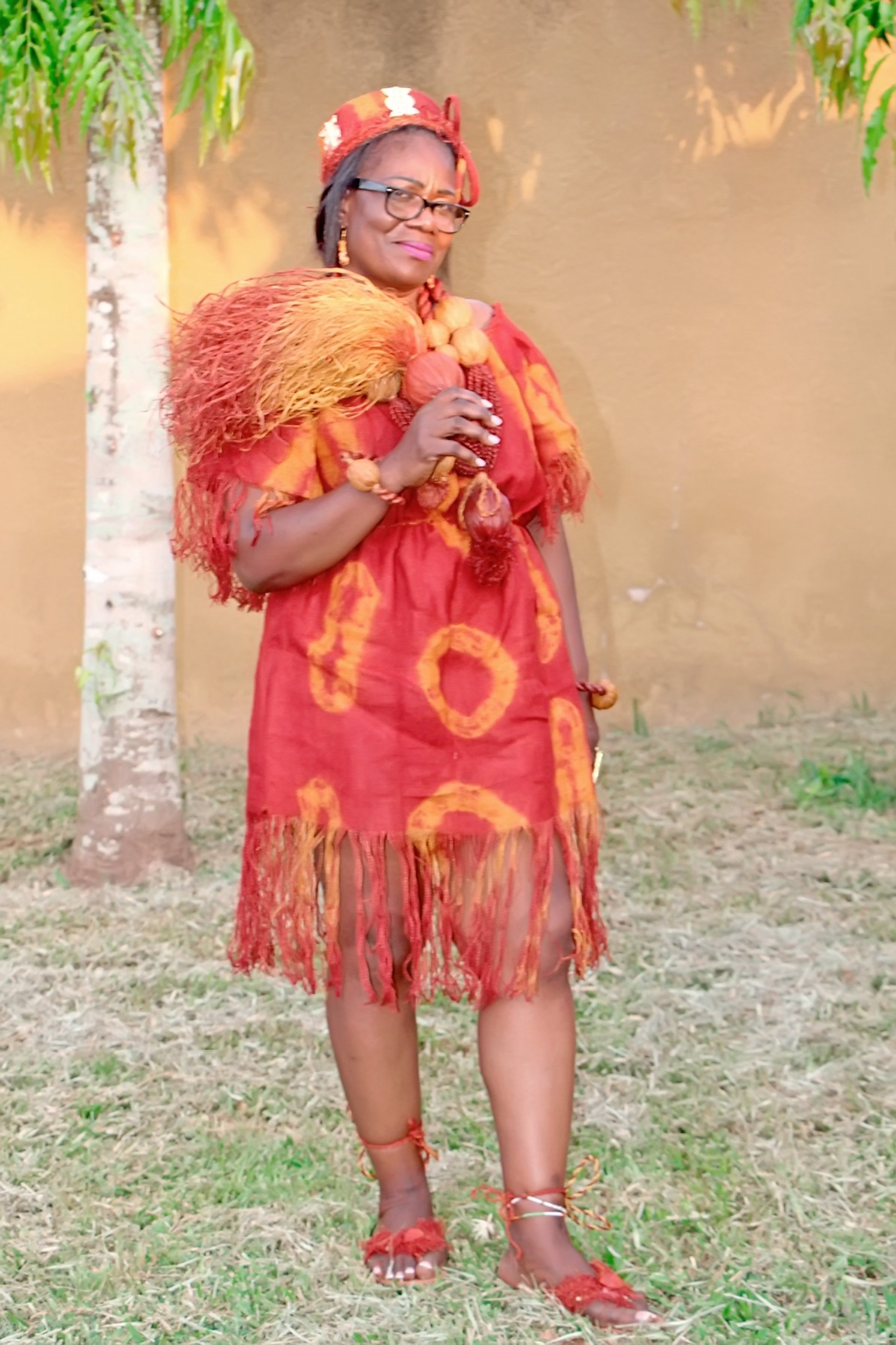 woman wearing yellow long-sleeved dress under white clouds and blue sky during daytime