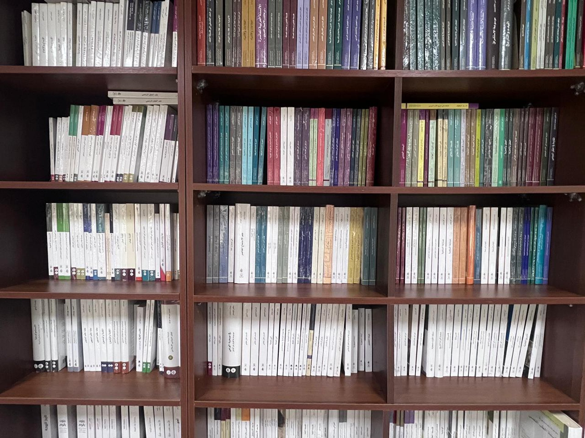 assorted-title of books piled in the shelves