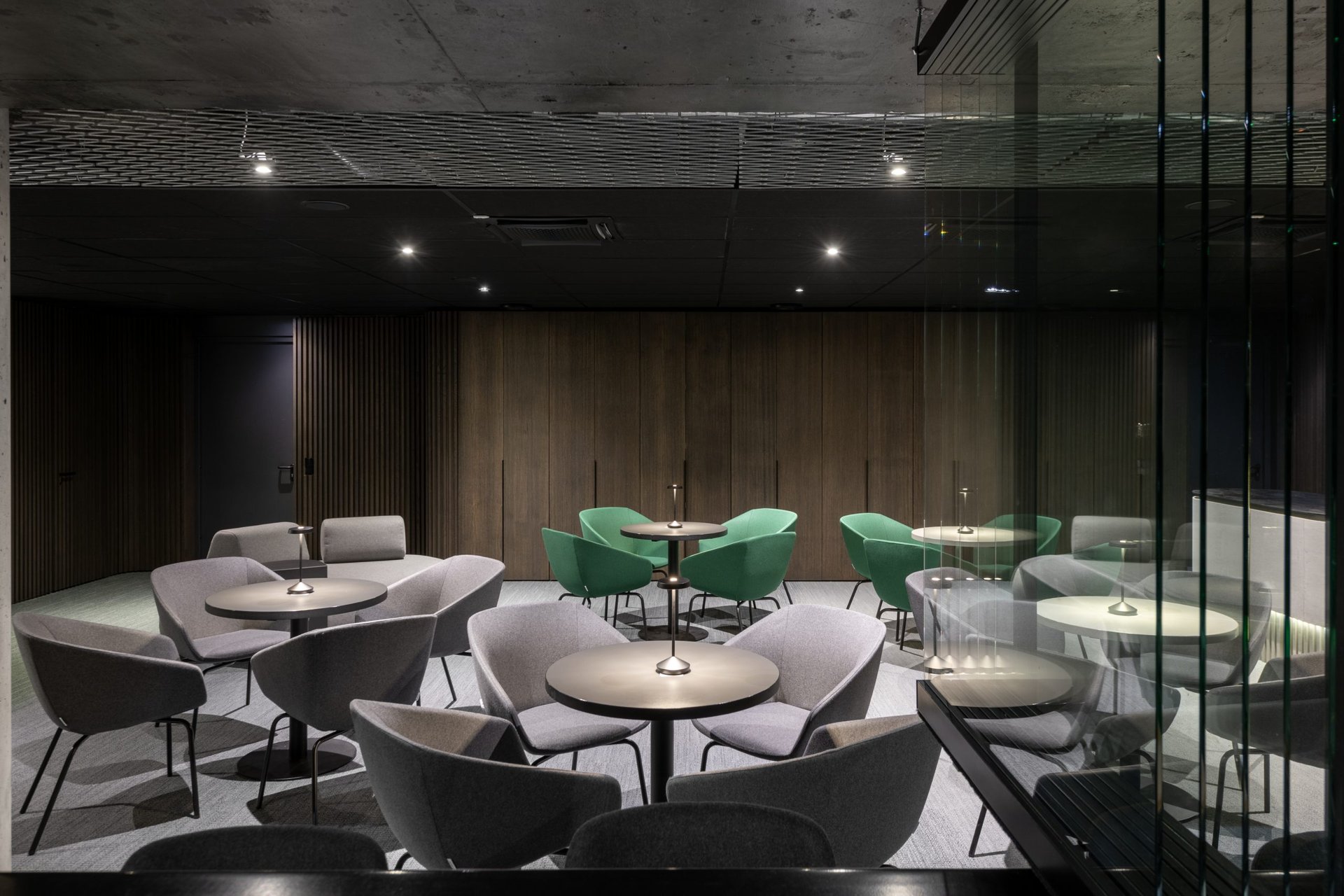 a dimly lit restaurant with tables and chairs