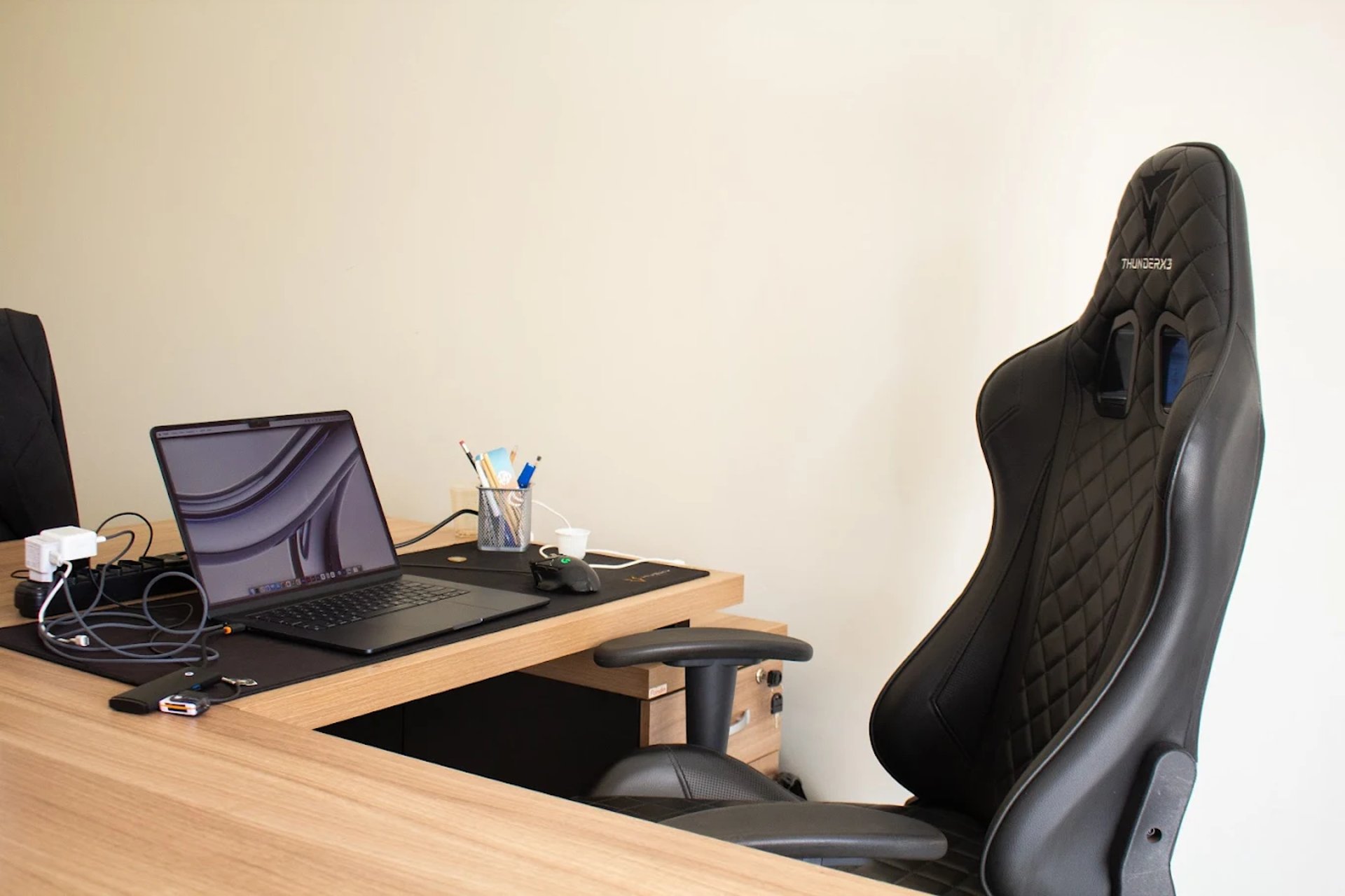 an abstract photo of a curved building with a blue sky in the background