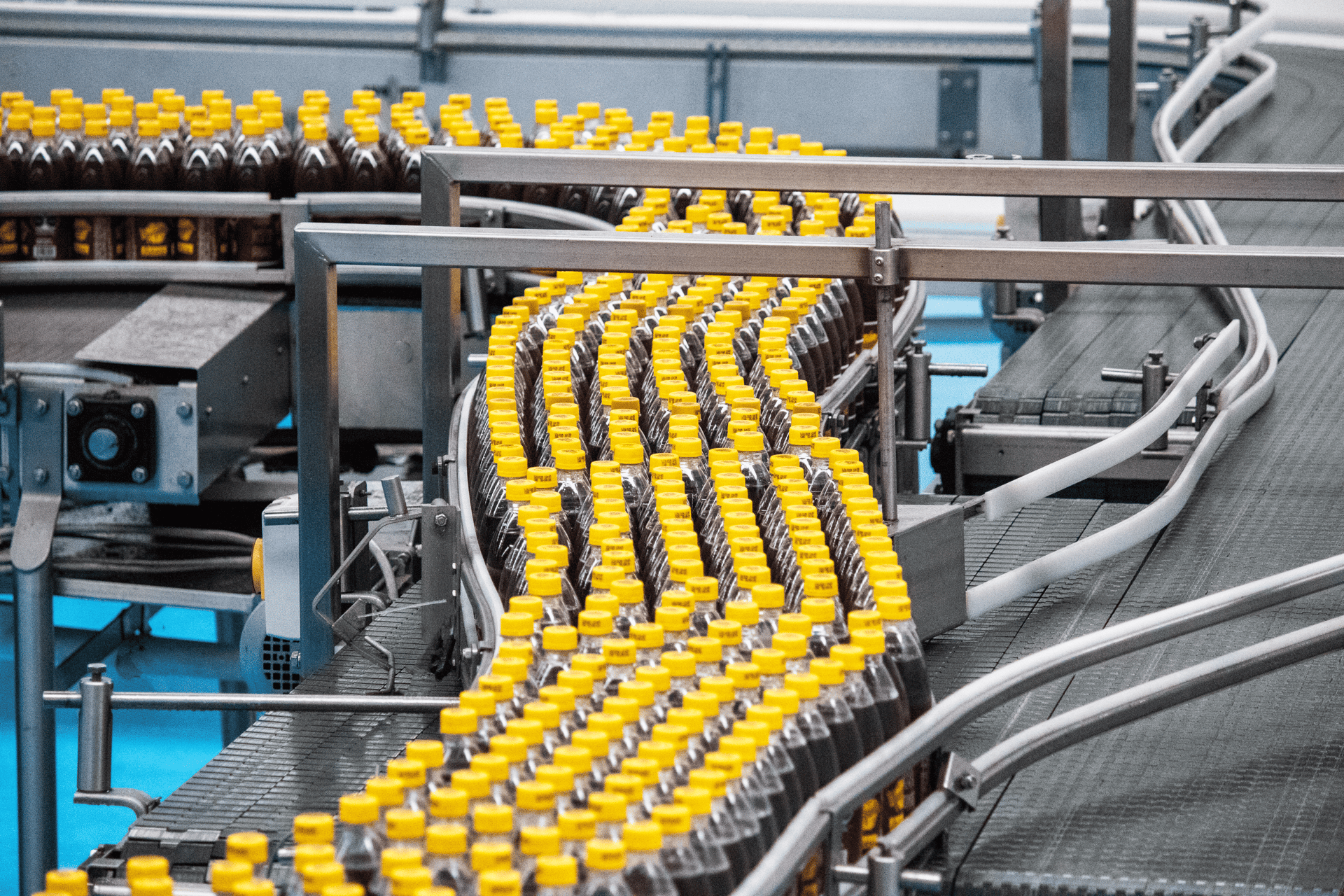 an abstract photo of a curved building with a blue sky in the background