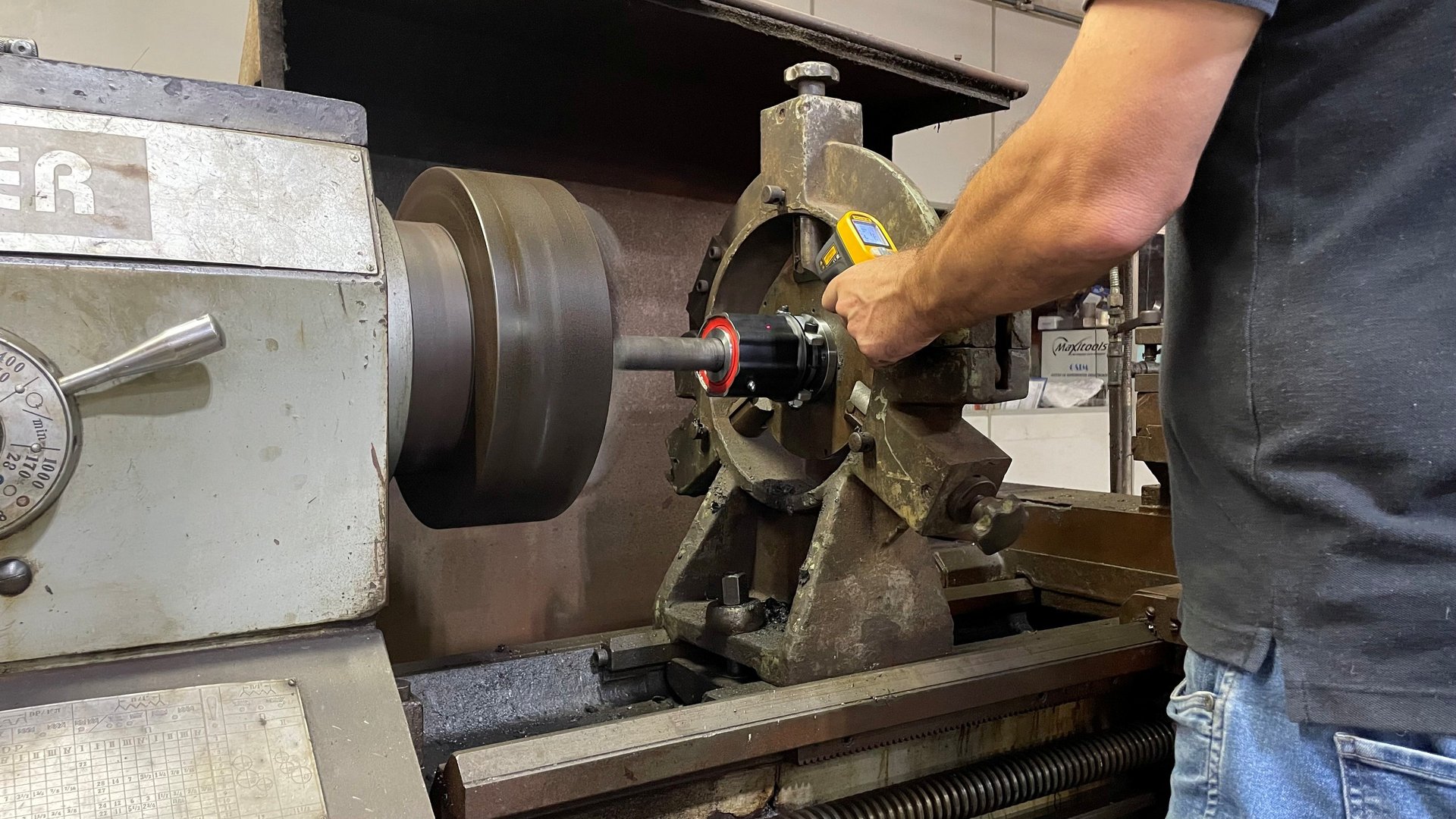 yellow and black tractor on green grass field during daytime