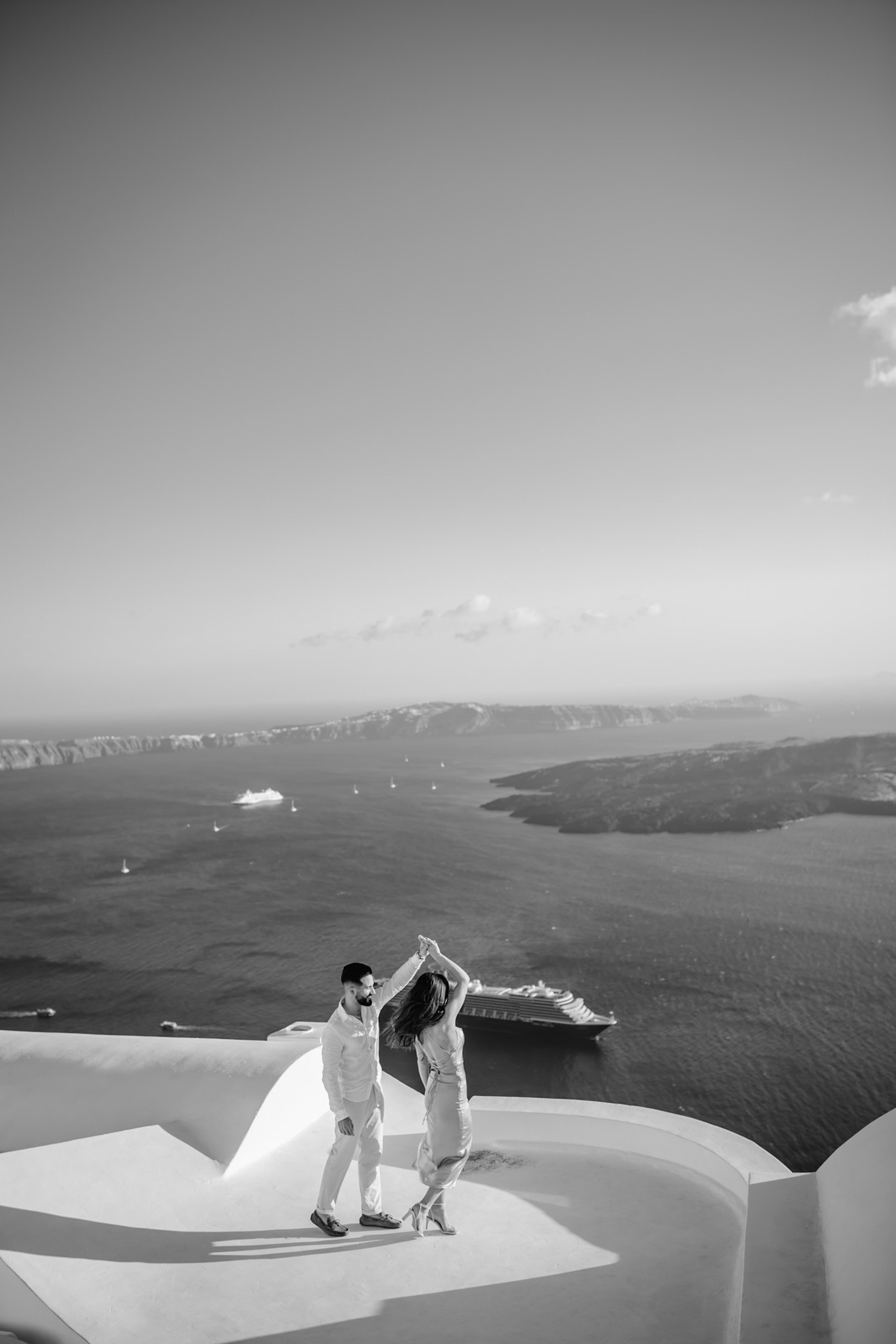 an abstract photo of a curved building with a blue sky in the background