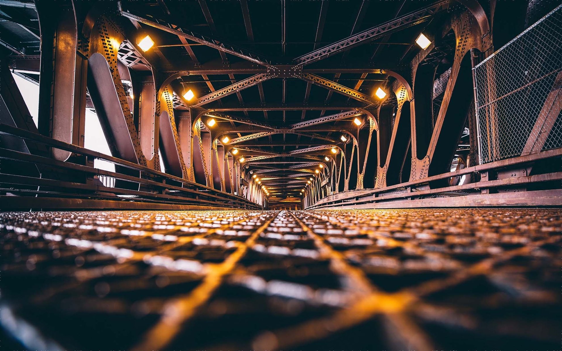 an abstract photo of a curved building with a blue sky in the background