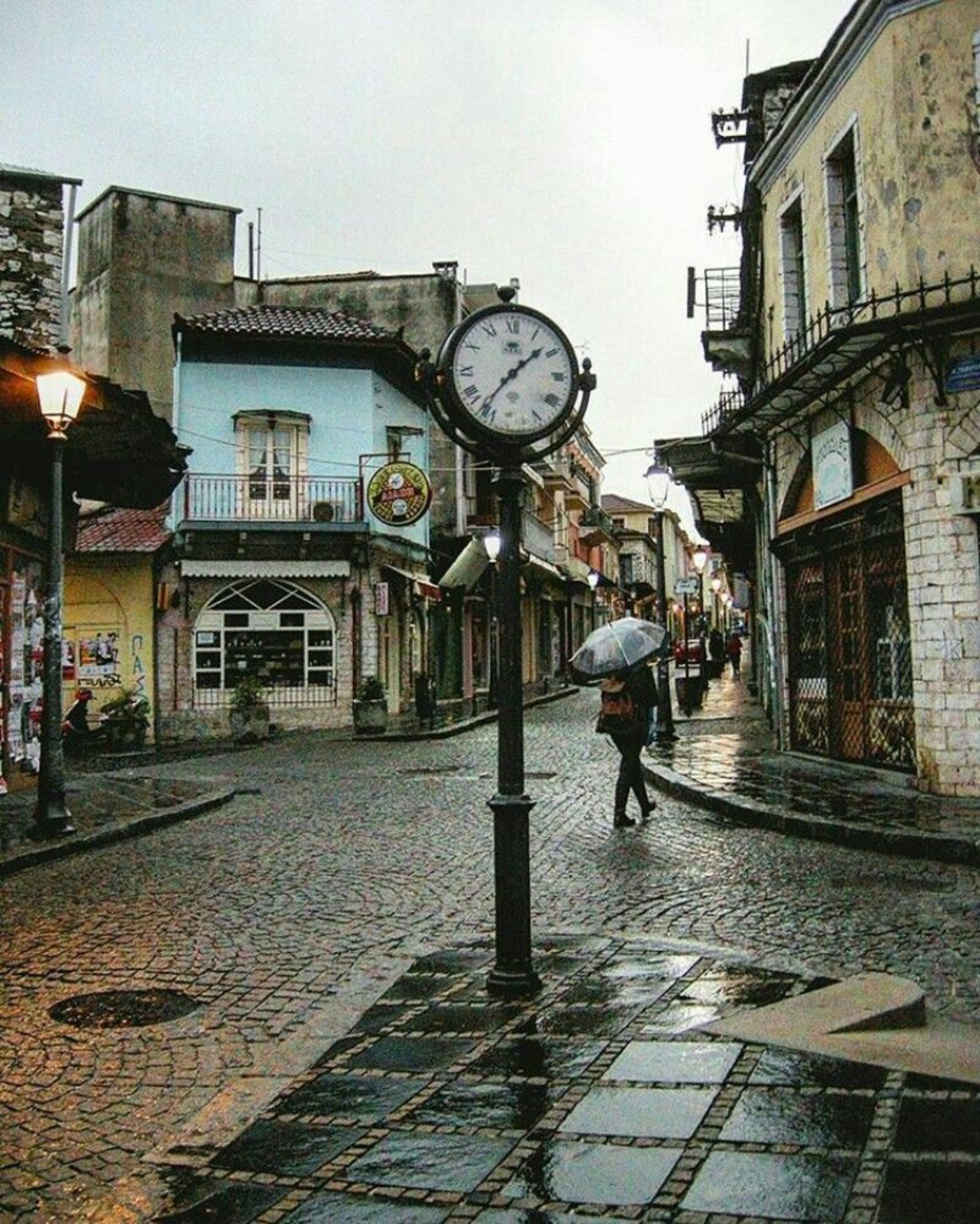 white and black analog clock at 10 10