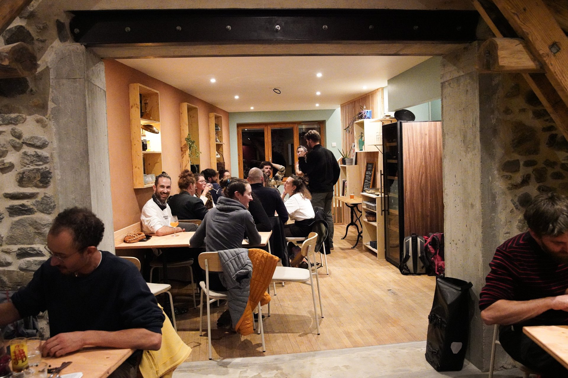 black kitchen appliance on kitchen island with pendant lights