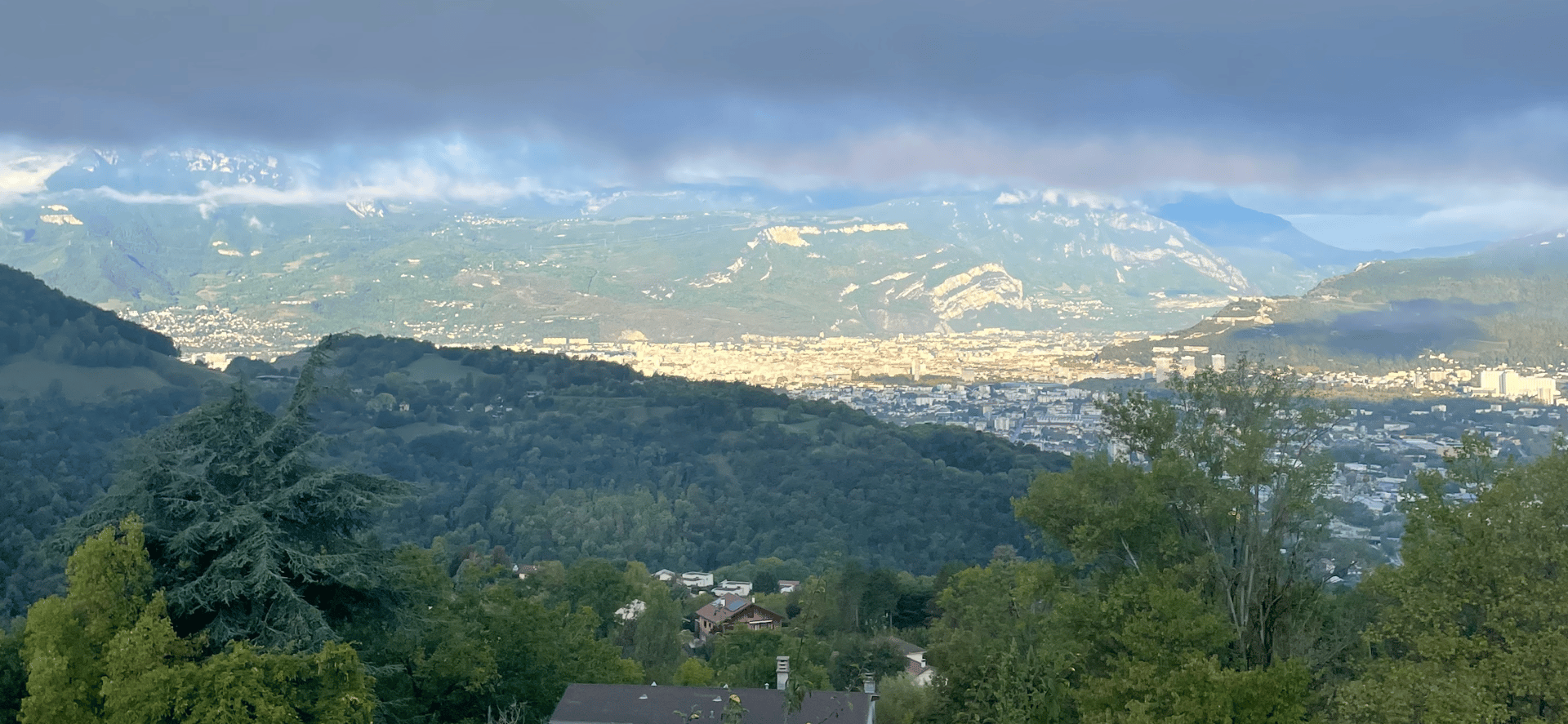 black kitchen appliance on kitchen island with pendant lights