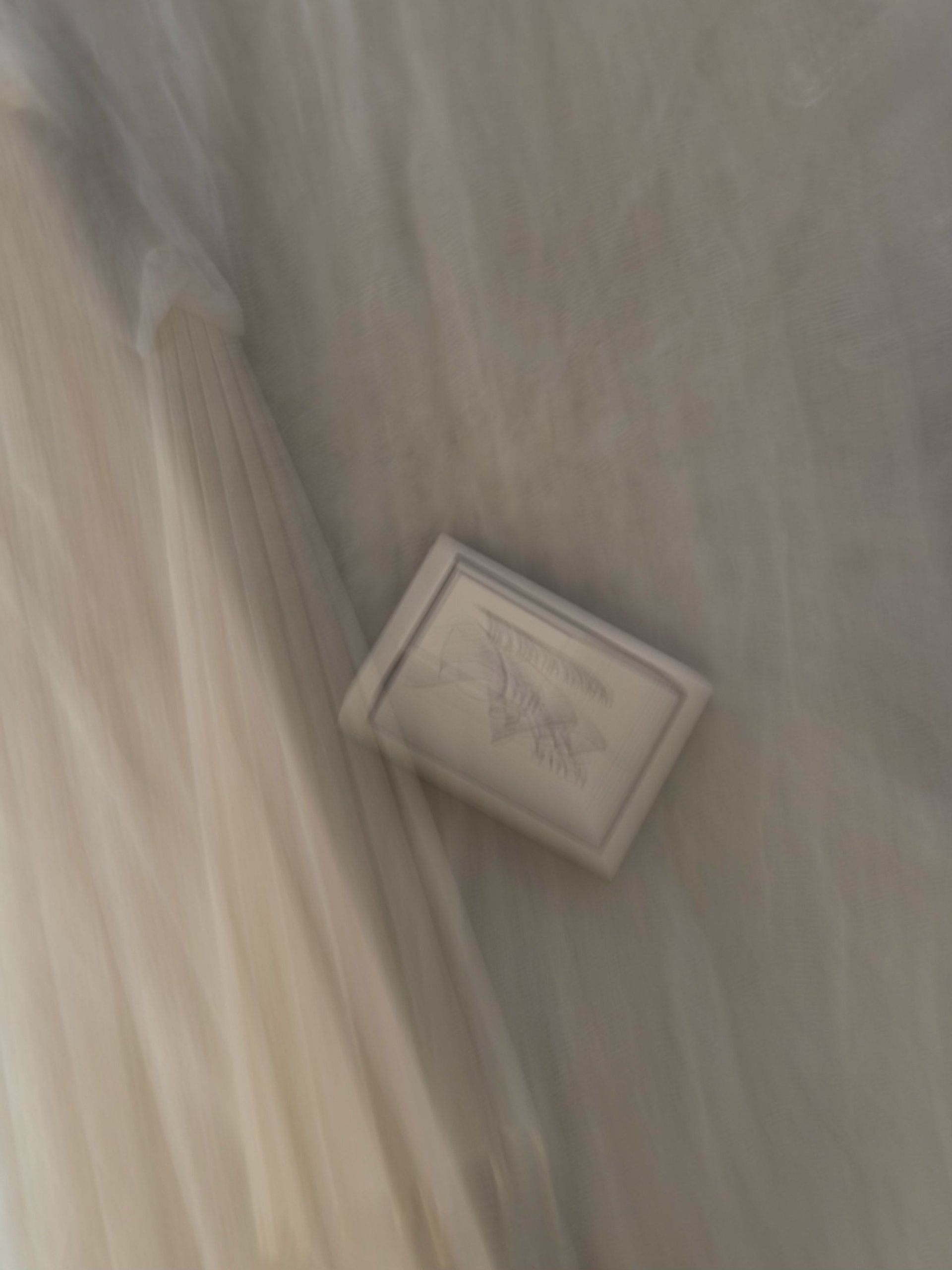 an abstract photo of a curved building with a blue sky in the background
