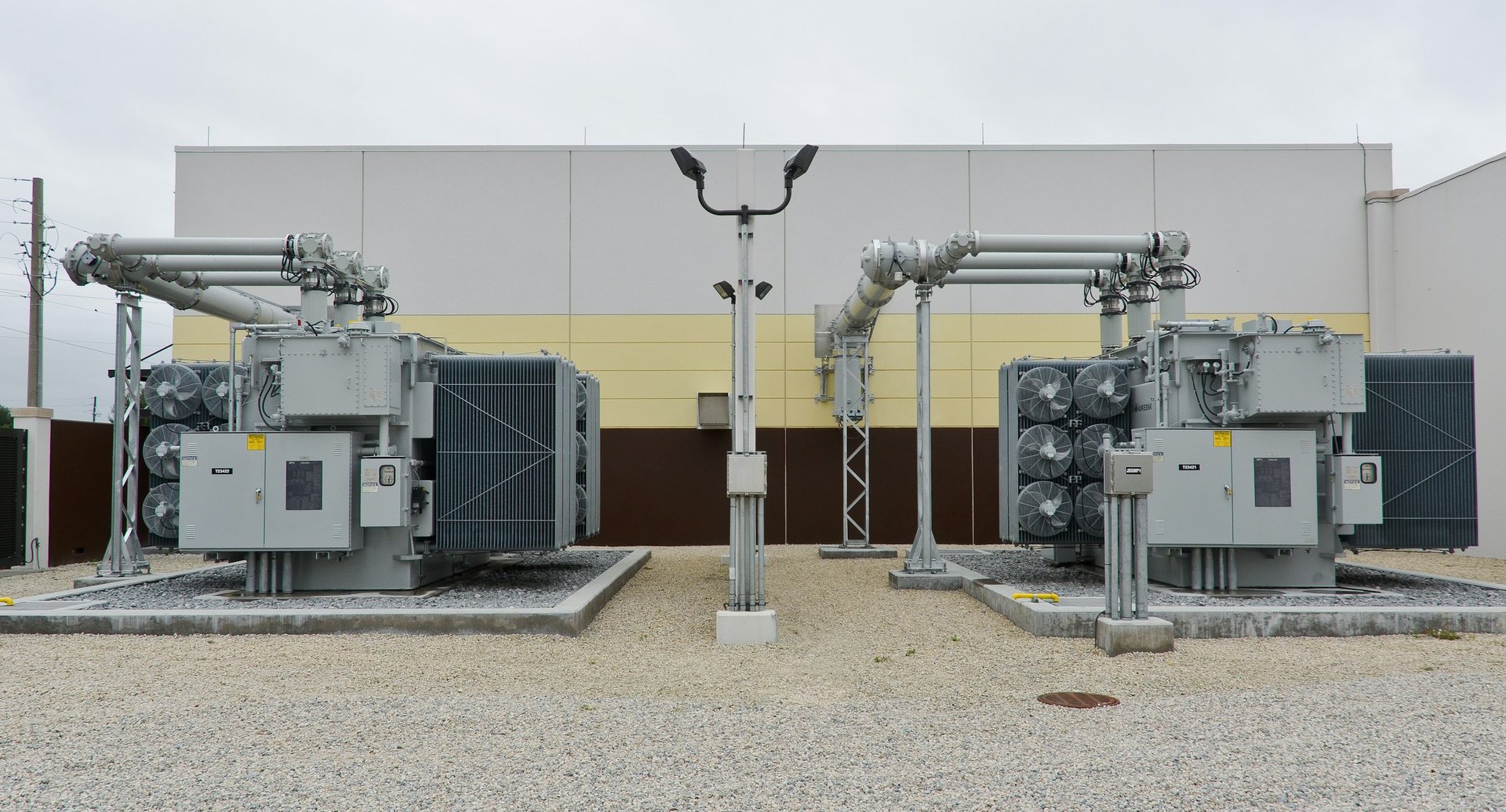 a factory with a lot of machinery in front of it