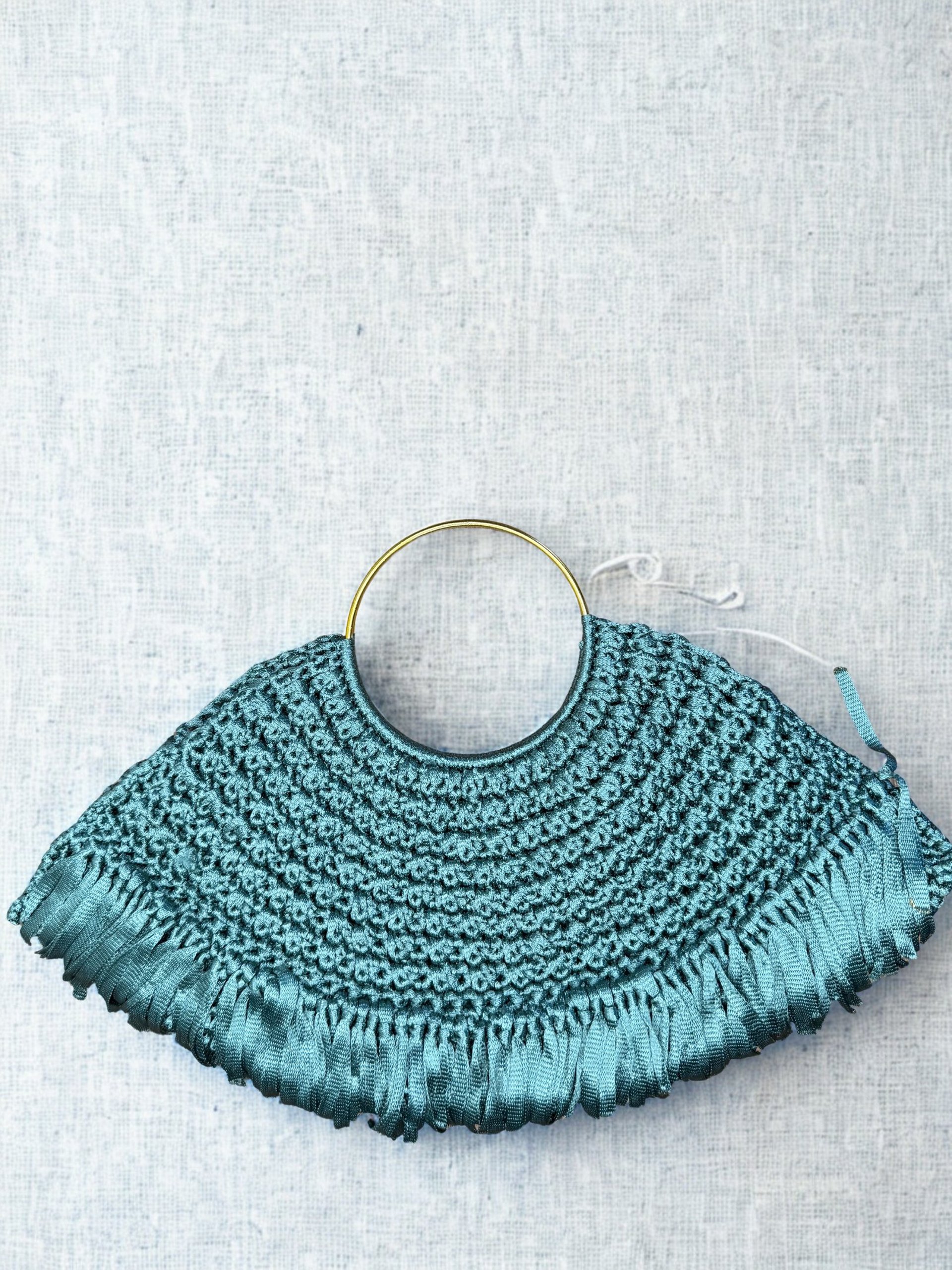 person wearing grey knit sweater