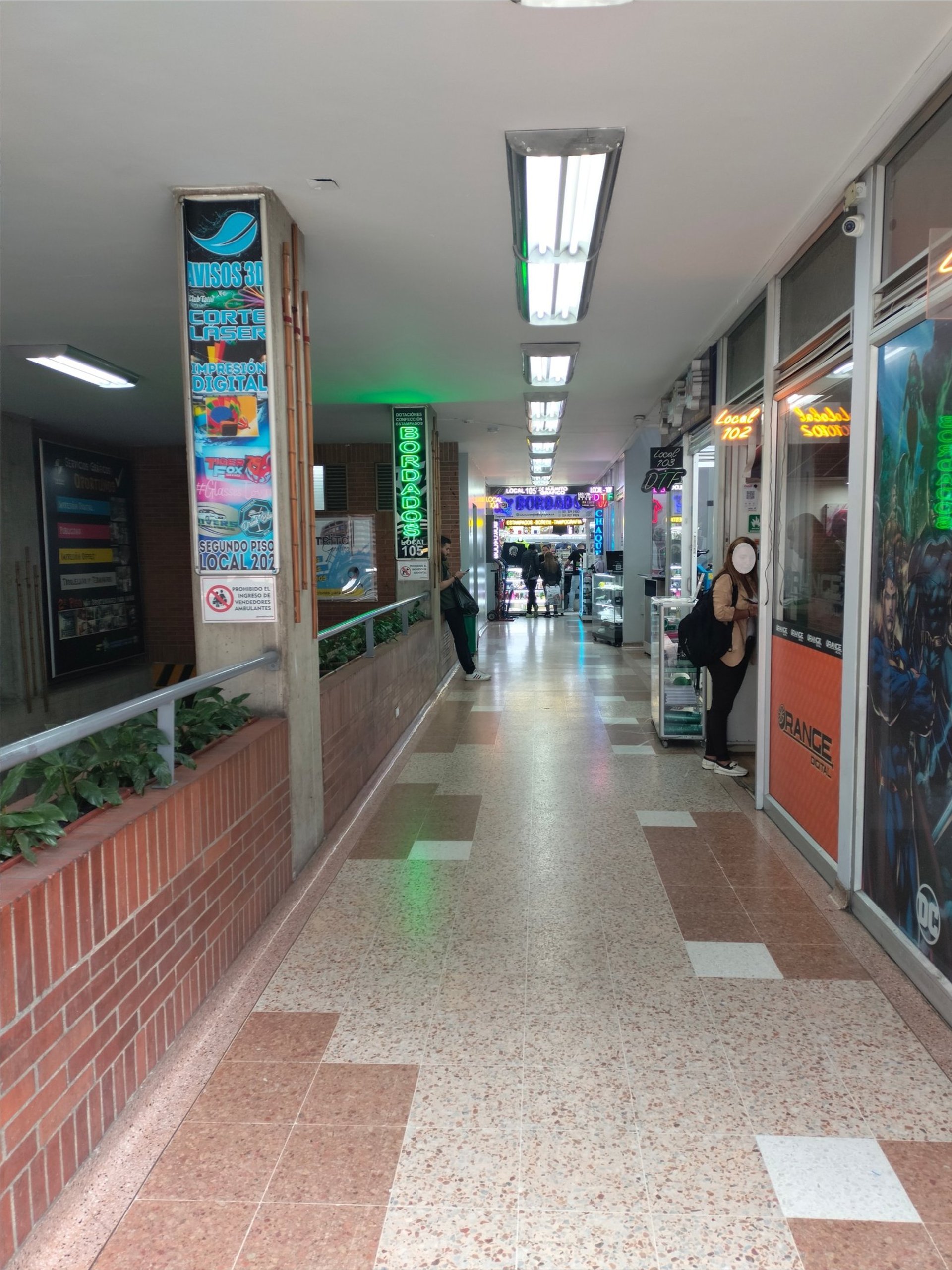 a man is walking past a vending machine