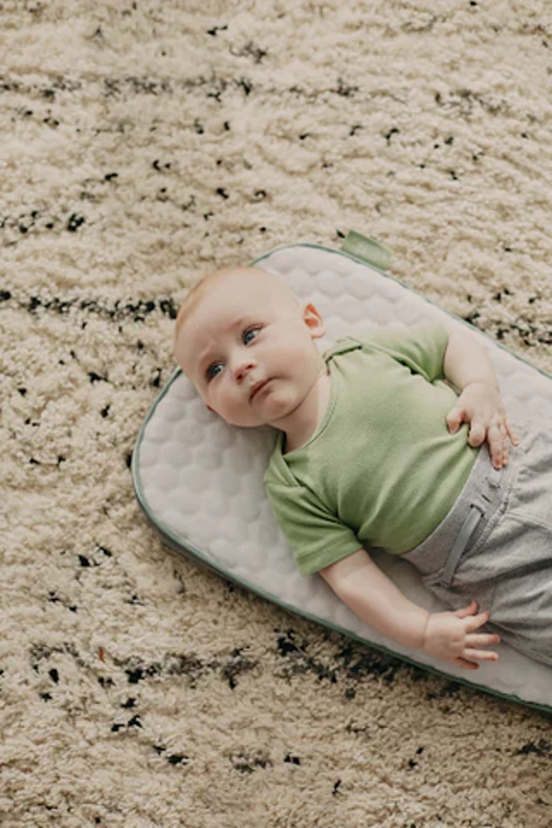 baby lying on freshly cleaned area rug