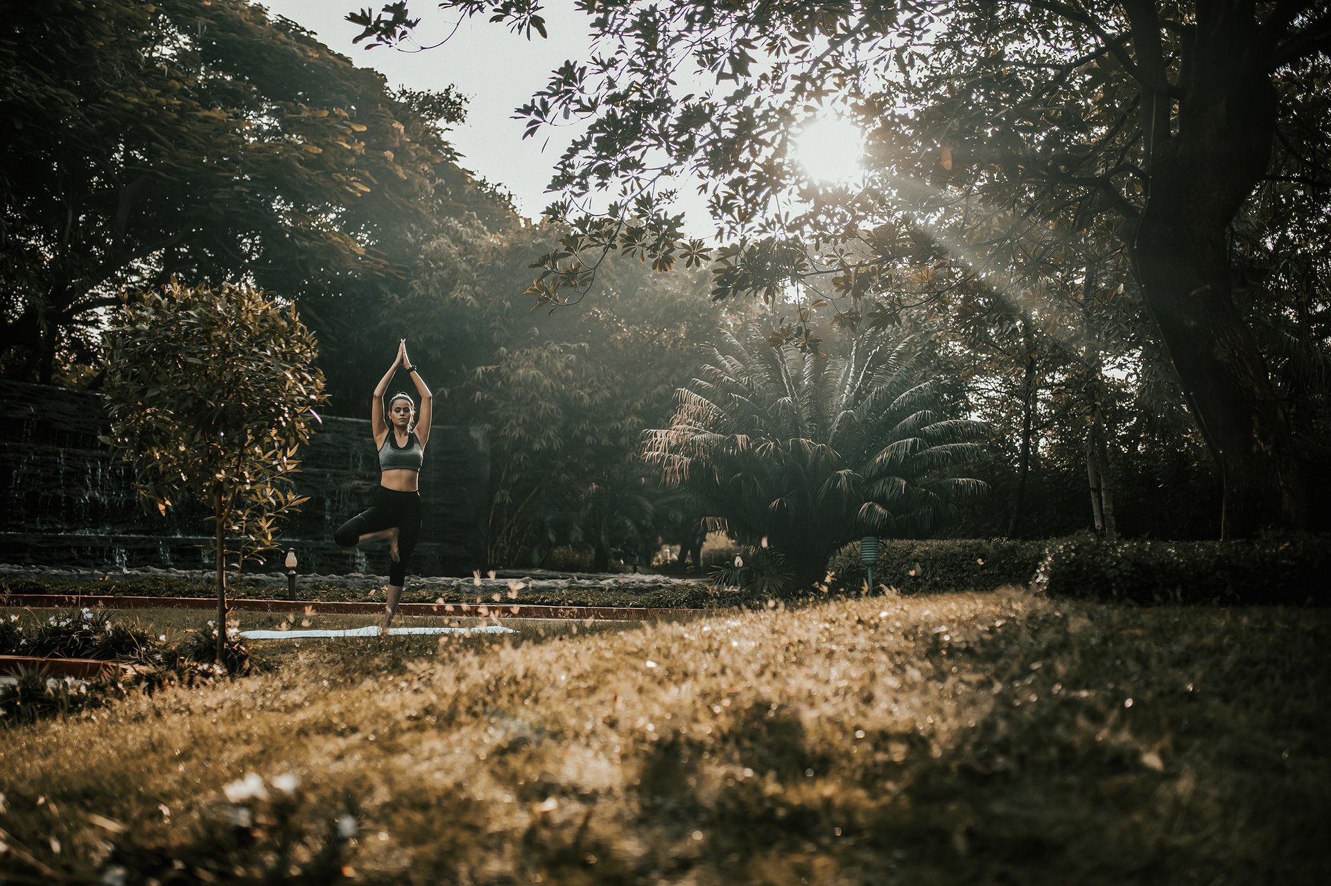 woman wearing yellow long-sleeved dress under white clouds and blue sky during daytime