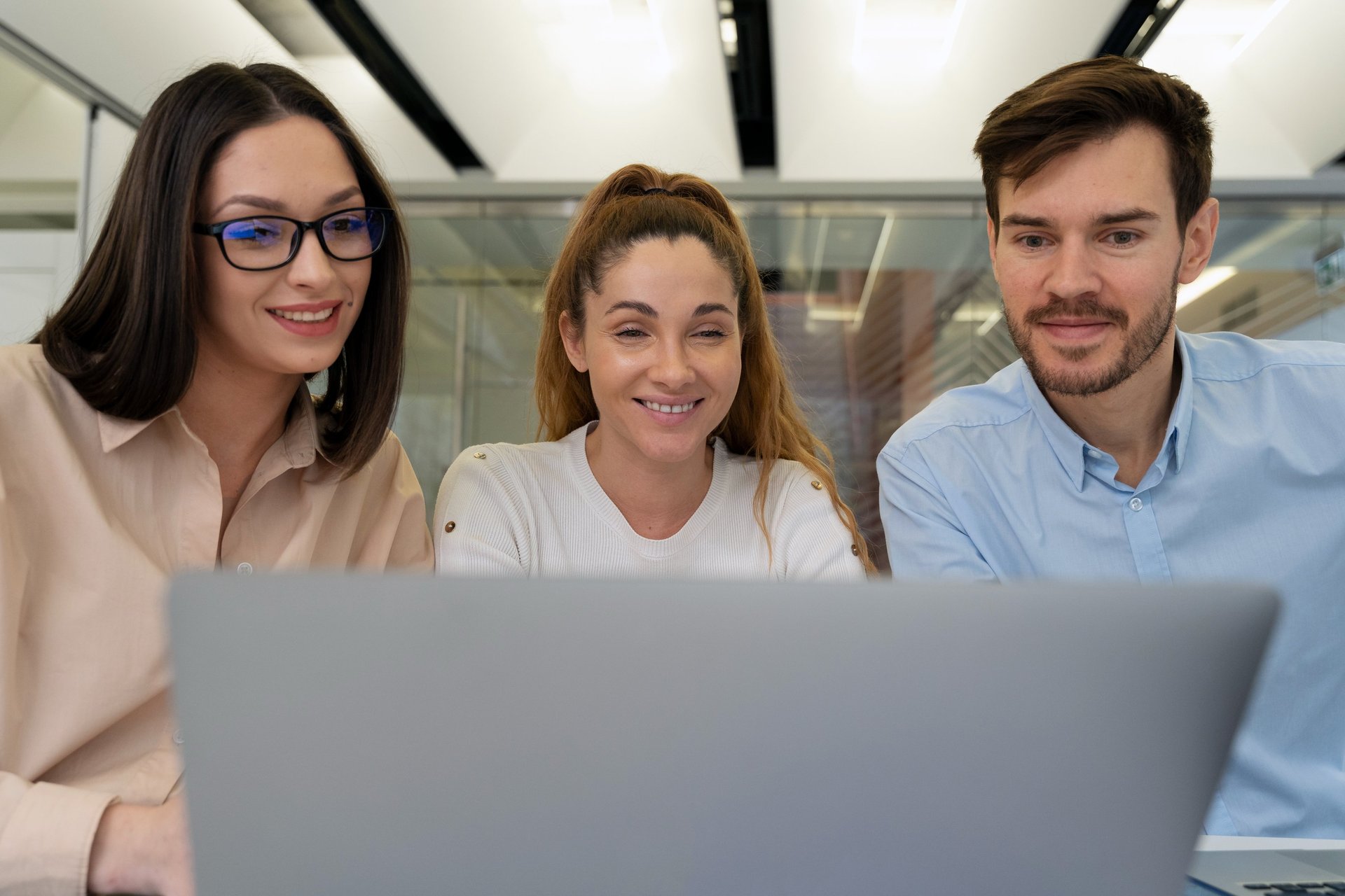 five person by table watching turned on white iMac