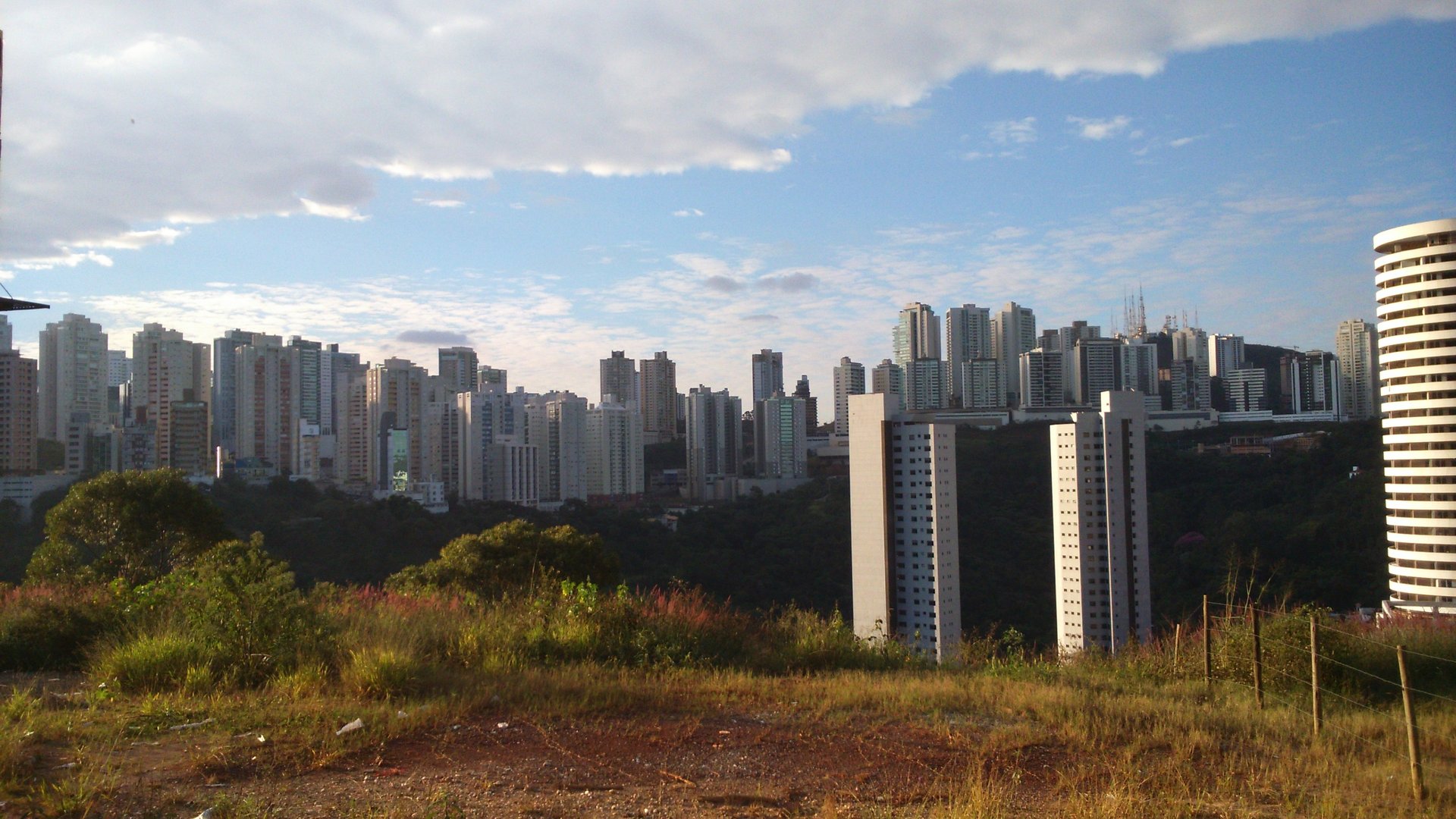 A view of a city with mountains in the background